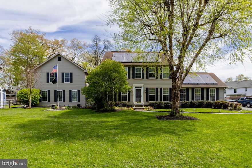 This is the one you've been waiting for! Set on a .76-acre lot, this expansive Colonial offers exceptional space and versatility! The main home features a large dining room with wood floors, a modern kitchen with stainless steel appliances and granite countertops, and a huge living room with a pellet stove. Enjoy additional living space in the family room with a gas fireplace, plus a convenient main-level laundry and full bath. The upper level boasts a spacious primary suite with walk-in closet and en-suite bath, along with three generously sized bedrooms and a hall bath. The partially finished lower level includes a rec room, den, and abundant storage. Need more space? A standout feature is the 2-story in-law/guest house addition with its own kitchen, living areas, bedrooms, and baths—perfect for extended family or guests. Step outside to decks, a hot tub, and plenty of room to relax or entertain. Additional highlights include an oversized 2-car garage, four sheds (including a boat-sized shed), and solar panels for energy efficiency. A truly versatile property with exceptional space and amenities.