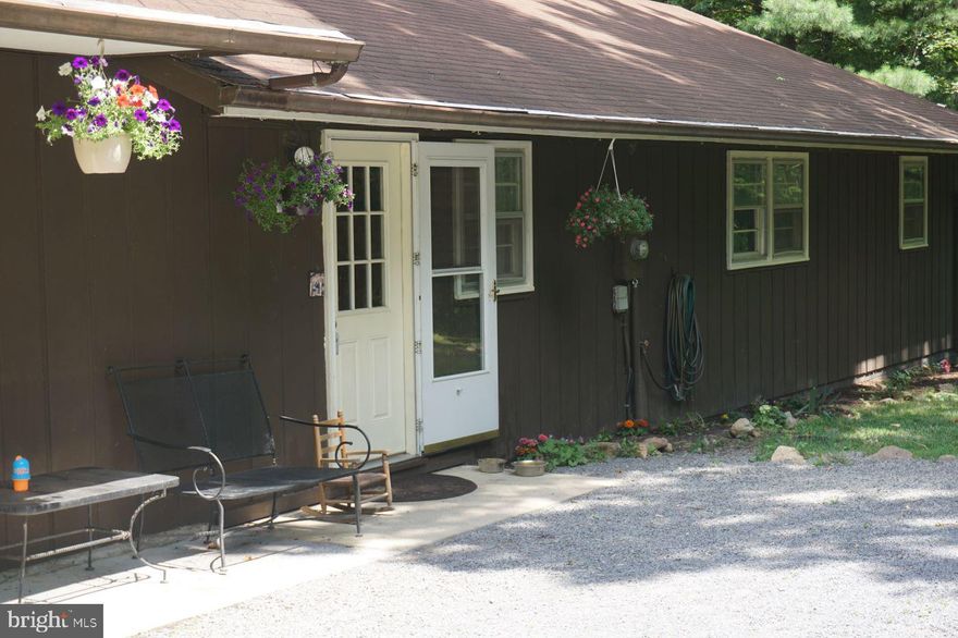 2,195 sq ft of floor space this ranch/rambler is located in a rural setting on 3 mostly treed acres.  Close to the George Washington National Forest and Bryce Mountain Resort (a 4 season resort). Not in a POA or HOA and as such no covenants and restrictions. Truly a "must see" and waiting for you to move in. Laminate flooring thru out with vinyl in the kitchen and 2 baths. Glass sliding door to large deck which includes a screened in area, lots of wildlife, etc. Appliances sold "as is".