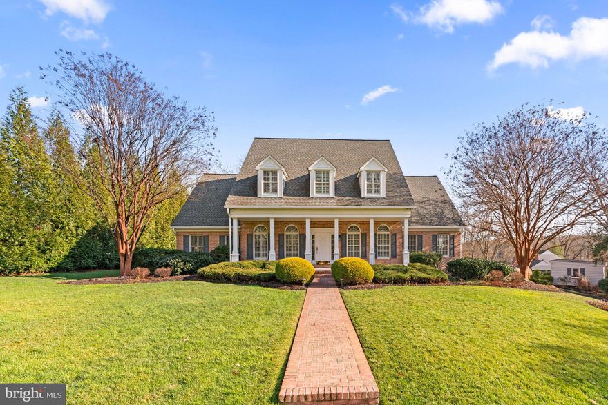 Welcome home to this gorgeous brick front grand colonial in the highly sought after, water privileged community of Point Field Landing. Wonderfully updated & meticulously maintained from top to bottom featuring lush landscaping, 3 car side entry garage, 4 bedrooms with 4.5 bathrooms across 3 finished living levels with over 5500 sqft.  An entertainer's dream both indoors and outdoors with a wide and welcoming front porch, manicured lawn and gorgeous paver patios, plus a spacious, traditional layout with a gourmet eat in kitchen, formal living and dining rooms, cozy family room with a fireplace and access to the patio.  Bright & sun filled with gorgeous hardwood flooring & neutral paint. The main level primary suite is spacious with ample custom closet space and private en suite bathroom complete with soaking tub, separate shower and dual sink vanity. 3 additional bedrooms on the upper level, one serving as a second full suite with private bathroom and dual closets.  Convenient main level laundry/mud room with side entrance.  Ample storage throughout including bonus attic storage. Just a short walk to the community pier and waterfront. Whole house gas generator & underground irrigation.  New Andersen Windows & plantation Shutters, New roof (2019) Easy commuter access via I97 & Rt 50. Close to shopping, dining & entertainment. Severna Park Blue Ribbon Schools