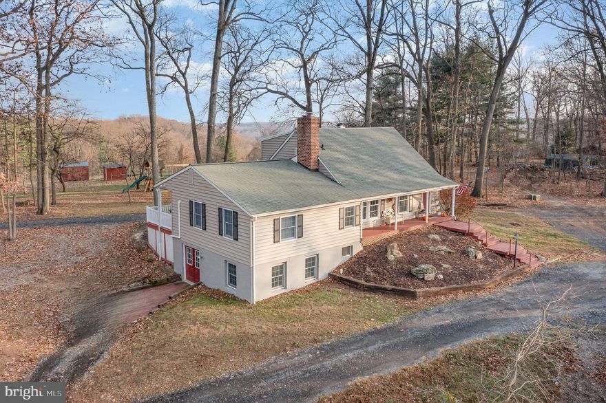 Recently appraised at $760,000.  Welcome to 35 N Tannery, located in beautiful Carroll County, Maryland.  This 11.59 acre farm / farmette with first floor primary suite / in law quarters is quite a find!  Tucked away for privacy, yet minutes away from shopping and dining options.  Featuring 5 bedrooms, 2.5 baths and a 2 car tandem exterior detached garage, you will be delighted at first sight!  Bring your farm animals and enjoy a home, away from the hustle and bustle of everyday life.  This home is full of hardwood flooring, beautiful attention to detail, gorgeous kitchen with granite counter tops, recessed lighting, stainless steel appliances, soft close cabinet drawers, under mount sink, finished family room in the lower level, walk out basement with double door entry for easy storage of outside items in the colder months, a 6 person hot tub, approximately 7 acres of fenced pasture, 25 x 23 Barn with electric and water, additional out buildings, mini split systems, oil, wood and electric heat, AWESOME fire pit with stamped concrete patio area, 3 exterior access water pumps, wooded and open area, updated vinyl windows, dining room with wood burning fireplace insert, covered rear deck, covered front porch, covered side porch, solar lights, radon system, washer, dryer, full bath rough in located in the basement, hardwood stairs, family room with box bay reading area, to include two skylights, central vac system, pantry shelving area and more!  Properties like this are a rare find!  Book your showing today!