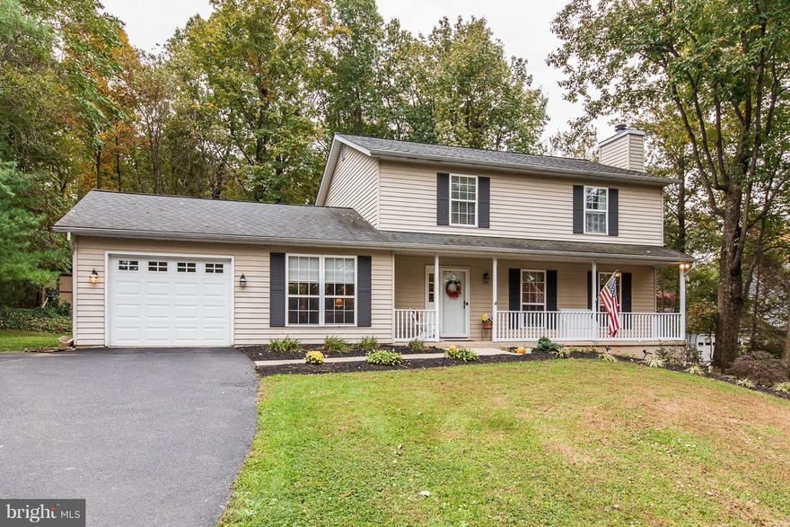 Stunning country home in Hampstead! Located on a beautiful, private lot. Home features 4 bedrooms, 2 1/2 baths, hardwood floors, two wood burning fireplaces, chair & crown moldings, stainless steel appliances, granite countertops, eat in kitchen, one car garage, large driveway & so much more! Updates include two Anderson sliding doors w/blind insert & foot locks(18), new deck w/pergola(18),new refrigerator(18),water heater(16),well water storage tank(16),refinished hardwood floors(16),radon mitigation system(16),roof replaced(09),heat pump system replaced(08),new paint throughout!  Oversized deck perfect for entertaining! Shed sold in "as-is" condition. Your country oasis awaits you!