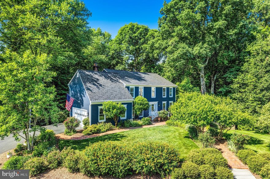 Open House Cancelled - Property is Under Contract - Beautifully and completely renovated 5 bedroom/4.5bath Colonial in the sought after neighborhood of Colvins Glen! Backing to trees on 1.23 acres this warm and inviting home includes a private multi tiered deck perfect for entertaining! The bright and sunny main level has Canadian maple hardwood floors throughout with a dedicated office/study, formal living room, formal dining room, separate mudroom, and family room with cathedral ceiling and wood burning fireplace. An updated eat-in kitchen with gas range, granite counters, 42” cabinets, and large pantry is the heart of the home.
The primary bedroom has 2 generous closets and the en suite remodeled primary bath includes a soaking tub, shower, dual sink vanity, and heated towel bar.  The upper level laundry room is conveniently located off the primary bedroom.    There are 3 additional bedrooms on the upper level with 2 additional updated bathrooms.
The walkout lower level features an expansive recreation room with an additional dedicated exercise/ game space. The 5th Bedroom and full bath make a great nanny or guest suite. This home has been well maintained with many additional improvements – Hardie Plank Siding (2020), New Roof (2021), Canadian Maple Floors (2019), water Heater ( 2018), Marvin Infinity Double Pane Windows, Master Shield Gutter System, EV car charger Ports ( 2023), Additional windows added to Dining and Living Rooms, Interior Freshly painted ( 2024), plus many more improvements. The stunning floral gardens add to the pleasing curb appeal. Easy access to National and local parks, major commuting routes, Dulles Airport, and the new Silver Line Metro provide a terrific location to call home!
Schools: Colvin Run/Cooper/Langley