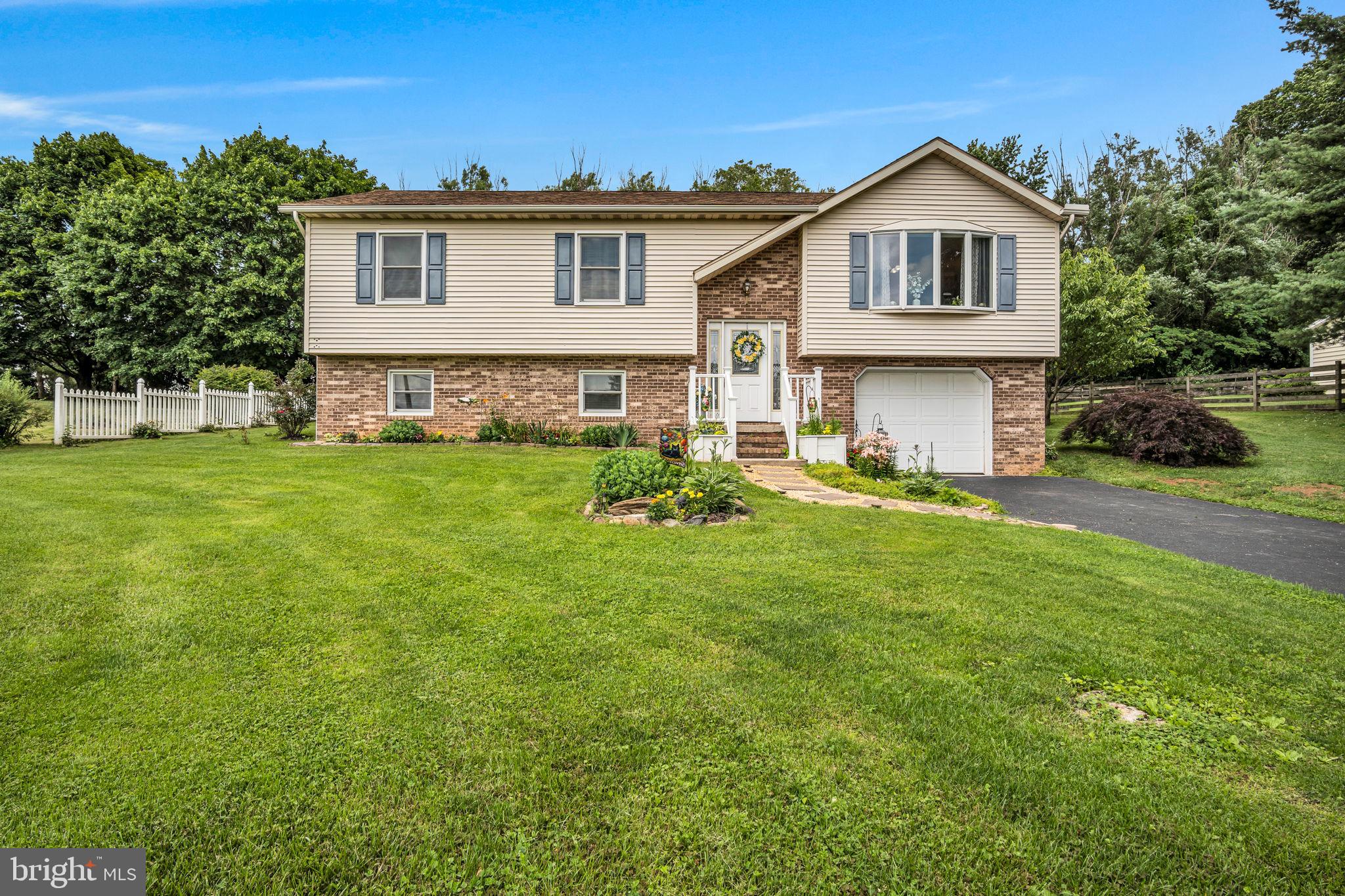 Welcome to this move-in ready 3-bedroom, 2.5-bath split-level home nestled on nearly half an acre in Hanover, PA. Perfectly positioned near the Maryland/Pennsylvania border, this property offers both convenience and tranquility with scenic views and a private backyard setting.
Step inside to find a functional and inviting layout featuring all three bedrooms and two full baths on the main level. The spacious, updated kitchen boasts stainless steel appliances and plenty of prep and entertaining space. Downstairs, the finished lower level provides a second living area and a convenient half bath—ideal for a family room, home office, or guest space.
Enjoy peaceful mornings and relaxed evenings on the beautiful backyard deck, overlooking the secluded yard. Whether you’re hosting or unwinding, this outdoor space is a true highlight. Don’t miss your chance to own this charming home in a great location close to major routes, shopping, and the Maryland line!