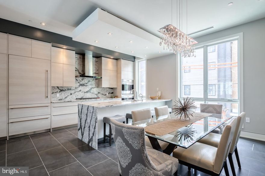 Welcome to gorgeous Liberty Estates, one of a kind New Construction with Elevator, 2-car garage, 4 Decks including two Roof-decks, Smart-home tech system, 4500sq' of Luxury and most finely appointed details in the city. Liberty Estates Townhomes has it all. Included in this sophisticated home is a theater room, and a game room with large wet bar that's perfect for entertaining. The living room, dining area and living room has heated floors. The wide open and extra wide living area has a built in fireplace with stone ledge, and this magnificent space spills onto a rear tiled deck that will make you feel like you are in Miami. The kitchen is spectacular, with Sub Zero and Wolf appliances, custom Italian cabinetry, custom counter tops including a HUGE island with cascading waterfall stone edge and a custom floating ceiling with accent lighting. The extra wide, 20' wide floor plan allows for a huge dining area right next to the kitchen. The interior iron railing system continues throughout the home along an elegant Black Walnut wood staircase. The roof decks are equipped with a kitchenette with sink, fridge and built in grill. The private deck off the master suite, and the deck off the living room supply a ton of outdoor square footage, totaling over 900 Sq feet. All of the bedrooms have great space and have ample walk in closets and accompanying bathrooms with the finest Grohe and Kohler finishes. The full floor master suite has it all, a six foot Kohler soaking tub, heated floors, double vanity, glass tile shower, deck and huge closets. Each bathroom is unique and has only the best materials. The woodwork throughout the home is stunning; including the custom baseboards and solid wood doors t/o. This may be the most well thought out home in the city. Not one inch of space has been wasted. Photos are of a similar unit. All square footage numbers are approximate and include above and below grade square footage. Square footage should be verified by the buyer. It is the responsibility of the buyer to verify real estate taxes.