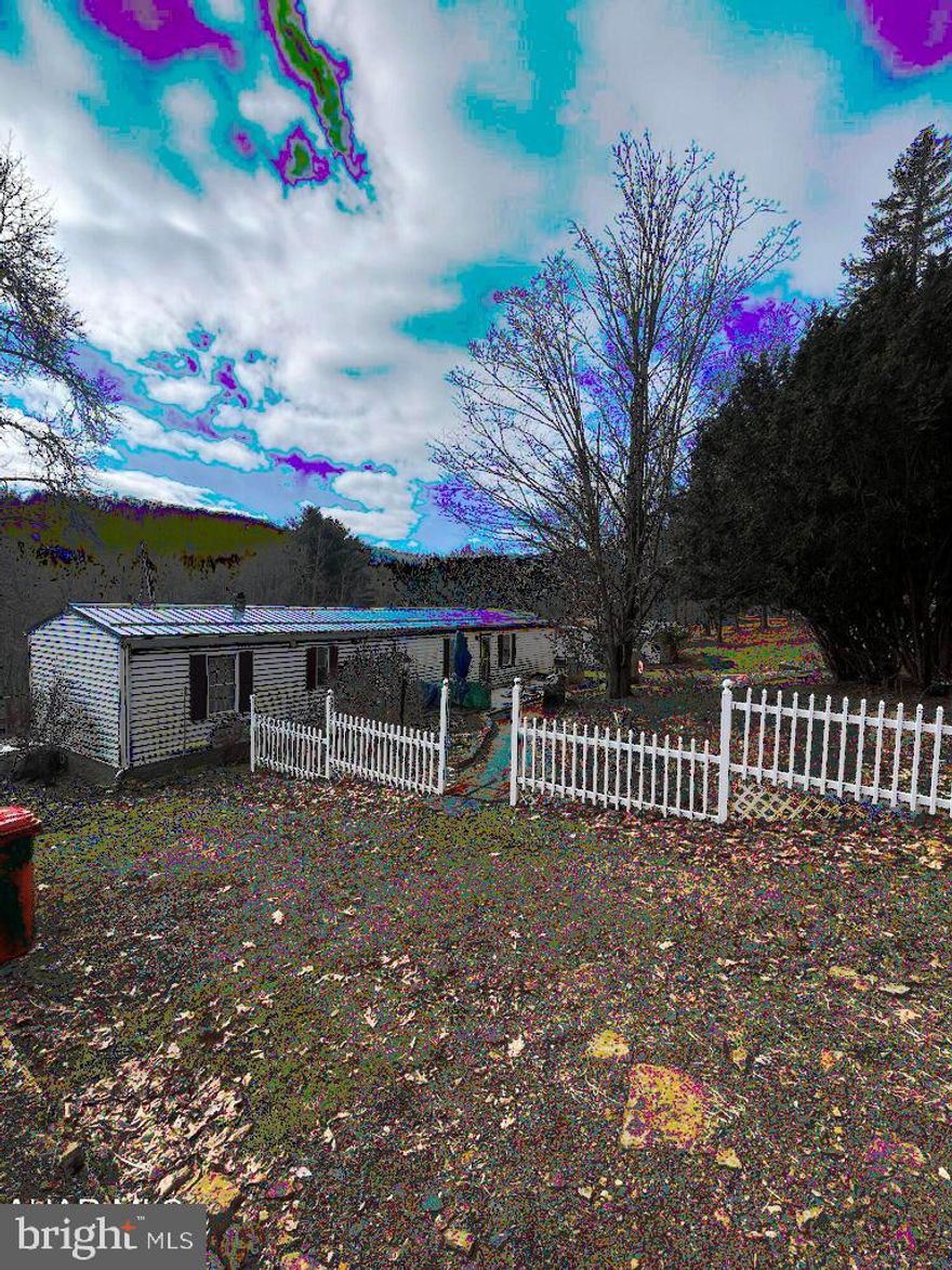 This 20 acre parcel offers privacy & opportunity for a great get-away as a hunting camp. Tons of wildlife and a large fresh water fed pond. Possible timber value and a gas well on the property so you have free heat! Mobile home is a 1994 and very clean - windows and roof have been replaced. There are 2 sheds on property and a spring house. Seller is older and will make no repairs. Seller must secure suitable housing.