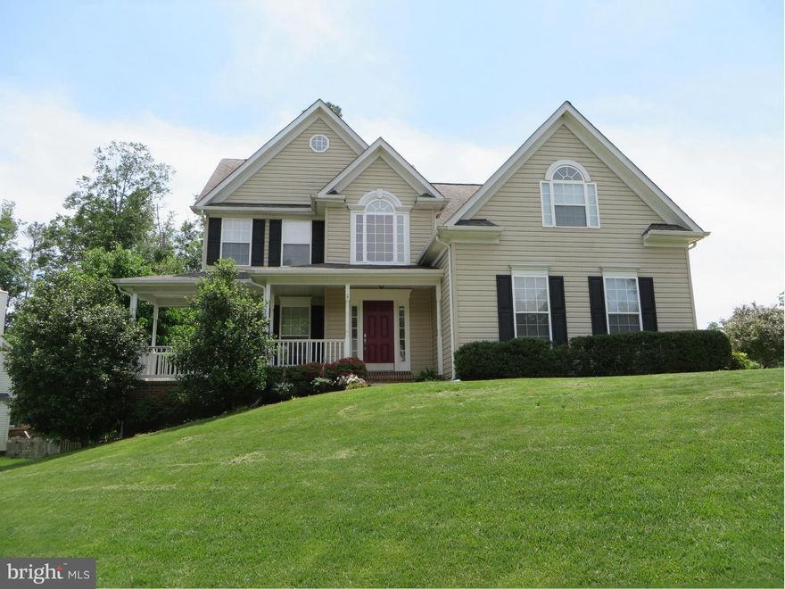 Delightful home w/everything you want! Big kitchen w/plenty of cabinet & counter space, pantry, brkfst bar; adjoining eating area; family room w/gas FP & built-in bookshelves. Separate DR w/pretty trim, hdwd flooring. Roomy MBR w/vaulted ceiling, 2 WICs, big bath w/soak tub & sep shower. Finished walkout bsmt w/rec rm, den, 3rd bath. New carpet, ht pump 2 yrs, wrap porch, deck, landscaping--hurry!