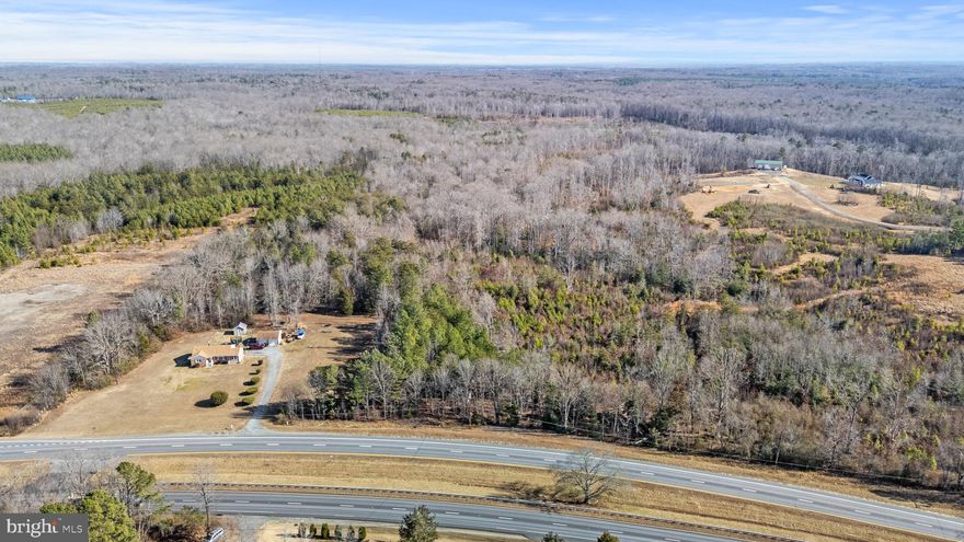 Rare opportunity to own 29 acres of pristine, wooded land with approximately 300 feet of frontage on James Madison Parkway (Route 301) in King George County, Virginia. This expansive tract offers a private, natural setting with excellent visibility and convenient access to major commuter routes.  Possible for subdivision.  LOE, soil evaluation  completed  in 2021 indicate the area would support at least 4-bedroom conventional septic system.  The site has been staked as Site 1-M (see soil documents attached).  About 300' State road fronttage.  Proximity to the Potomac River, Caledon State Park, and other natural attractions. Close to shopping, dining, commuter corridors, and outdoor recreation. 25 miles to Fredericksburg,  65 miles to DC, 55 miles to Richmond. CONTACT THE AGENT FIRST TO SHOW PROPERTY AND FOR MORE DETAILS.