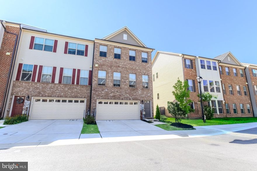 Move-in Ready and absolutely beautiful! This meticulously maintained and spacious 3-level, 3,270 sqft end-unit townhome offers elegant living.   Located in a desirable location, just off MD-301 in Bowie, MD, the community offers easy access to Washington, DC, Annapolis and Southern Maryland.  Enjoy a modern open floorplan featuring an oversized family room with a stone fireplace for additional warmth and coziness. The huge chef kitchen offers a large center island making it perfect for family and friends to gather.  The home offers vaulted ceilings, crown molding, and recess lights throughout.  This 3 bedroom, 3 full bath, 1 half bath home features a 2 car 412 sqft garage which includes an EV charger.  ALL OCCUPANTS MUST BE LISTED ON APPLICATION. ALL OCCUPANTS OVER 18 MUST FILL OUT AN APPLICATION.  RentSpree link for application - https://apply.link/0lVdSTw. Schedule your private tour today.