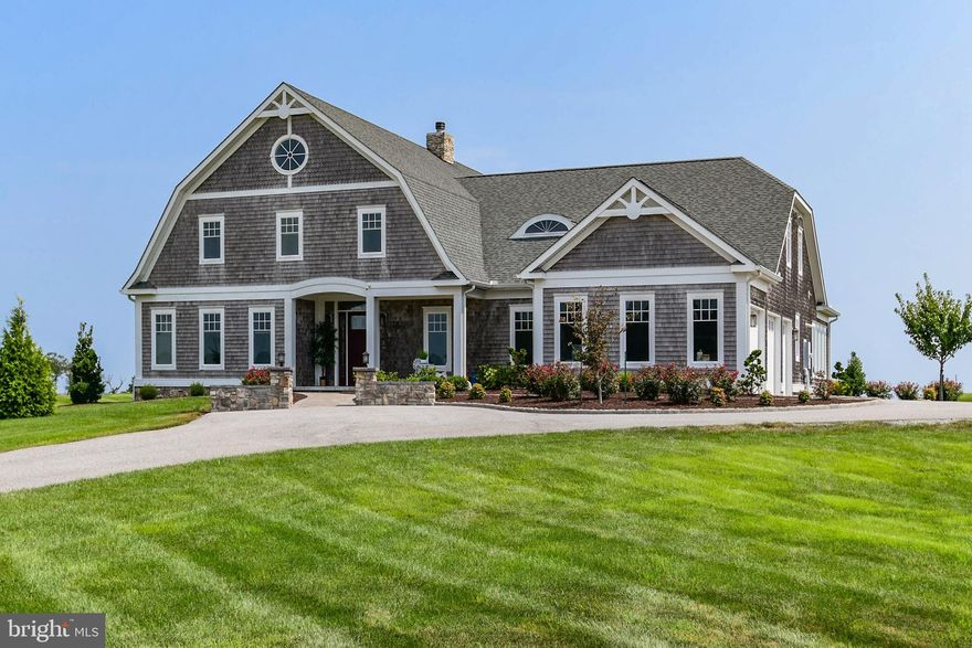 Striking luxury waterfront custom Nantucket style coastal home with 4 BR/4.5 BA located in the prestigious community of Rum Pointe, which has an incredible golf course. If you are looking for a lifestyle of golf, water sports and a clubhouse look no further. This home is meticulously appointed and has a sweeping million dollar panoramic view overlooking Sinepuxent Bay, Assateague National Seashore Island and the golf course. From the minute you drive up you will see the professionally landscaped yard and paver walkway. You will love the large covered front porch for relaxing and watching sunsets. As you walk through the front door you will immediately notice the open floor plan and custom floors, upgraded lighting and extensive millwork throughout. The open floor plan leads to a spacious great room overlooking the 16th hole and the Bay. The chefs kitchen flows to the large dining area making it the perfect place for entertaining family and friends. The gourmet kitchen has a large pantry, stainless steel appliances, granite countertops, upgraded cabinets and tile backsplash. Off the family room you will see a wall of glass doors that open a full 20  to the rear covered porch. You can easily bring the outside in with the remote control screen system spanning 50 ft of the main level rear porch. This makes a perfect setting for fabulous entertaining with the backdrop of the golf course and the Bay. There is a large sunroom off the family room for reading and relaxing. Also, on the first level you will find the spacious master suite with a sitting area, fireplace, large walk in closet, and a lavish master bath with all natural stone. There is an additional bedroom suite on the first level and a utility room and laundry room. On the second floor there are two additional bedrooms and 2 baths, a large game room, storage space and a loft. Your guests will also enjoy the second floor deck for relaxing and taking in the water views. Other features of this home include white cedar shake siding, fire pit, geothermal heat and AC to compliment the radiant heat throughout the ground floor slab, extra large 2.5 car garage, foam insulation, 10 ft ceilings on the main level, 9ft on second floor, 8ft solid core doors throughout the main level, a large wood burning fireplace in the great room and a gas fireplace in the master bedroom. The community offers golf, a fishing and crabbing pier, kayak launch and paddle board area.