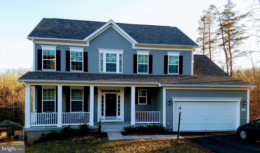 3% buyers credit. 1 Year New Home.  9' ceilings on main floor, hardwood and carpet, granite counter tops in kitchen with eatin kitchen open to family room.  Powder room on main floor.  Master plus 3 more bedrooms on second floor.  Large master bath with water closet and large walkin closet.  Basement is a full walkout with french doors, window and rough in for full bath.  Top of the line lenox hvac, professional water heaters.  Basement is ready to finish off with french doors in rec room, bath and bedroom. with window.  $2000 fee to join Lake Holiday.