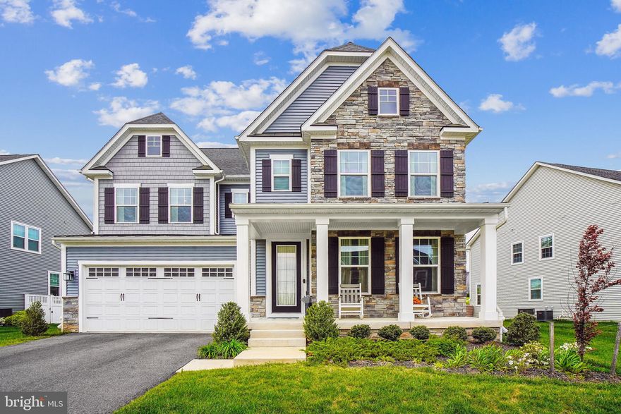 **Step into a world of sophisticated luxury and effortless flow!** 
This stunning 5-bedroom, 5.5-bathroom masterpiece welcomes you with soaring 9-foot ceilings, bathed in abundant natural light and adorned with elegant custom window treatments. Experience the modern feel of luxury vinyl plank flooring throughout the spacious first and second floors. Discover a beautifully designed layout: An impressive main-floor office suite (perfect for in-laws/guests or professionals) boasts its own full bath and walk-in closet. Entertain effortlessly in the formal dining room before flowing into the heart of the home – a gorgeous gourmet kitchen featuring barely-used stainless steel appliances, gleaming granite countertops, a sprawling island, soft-close cabinets, a massive pantry, and a convenient upgraded mudroom leading to your 2-car garage. Savor morning sunlight in the expansive breakfast area, surrounded by huge windows, and step seamlessly onto your serene screened deck for al fresco relaxation. Upstairs, a spacious welcoming sitting area leads to your lavish master retreat, complete with a double vanity, pristine soaking tub, separate shower, and a custom walk-in closet featuring a dedicated makeup area. A junior suite offers private luxury with its own bath and walk-in closet, while two additional bedrooms share a convenient Jack & Jill bath. The incredible lower level awaits your vision – a super-spacious, versatile canvas with a full bath, ready to transform into your dream gym, theater, office, or family fun zone! Nestled for ultimate convenience with easy access to DC, Baltimore, and Annapolis, this exceptional home blends high-end finishes, intelligent design, and a prime location into the perfect luxury lifestyle. Your dream home awaits – schedule your tour today!