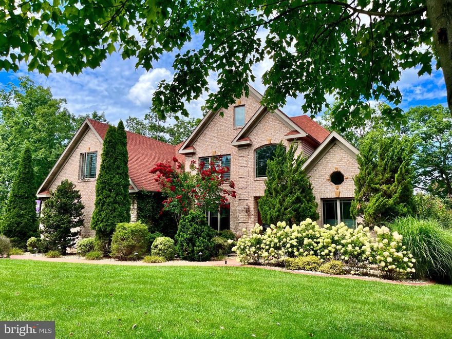 Active Under Contract with Home Sale Contingency and 72 Hour Kick-out Clause. 

Nestled on a private cul-de-sac in the Lakewood Subdivision, this exquisite lakefront residence, a bespoke creation by Hillegas Construction, presents a captivating blend of luxury and scenic beauty. The brick veneer custom colonial, boasting meticulous craftsmanship, invites you into a world of comfort and elegance.

The heart of the home, a spacious gourmet kitchen, locally handcrafted custom cabinetry, a central island perfect for culinary endeavors, and an array of appliances. The breakfast room and adjoining sitting area offer panoramic lake views, seamlessly connecting to a sprawling deck where 180-degree vistas unfold. Descend the stairs to discover an enticing pool area and direct access to the lakefront.

The main level grand room, adorned with engineered wood flooring, embraces natural light and lake panoramas through a wall of windows. A propane fireplace adds warmth, while built-ins enhance both functionality and style. The formal dining room, adorned with solid oak hardwood floors, provides an elegant setting for gatherings.

The primary bedroom suite on the main level is a retreat in itself, featuring ample walk-in closets, a ceramic shower, and a soaking tub. An exterior door leads to a private deck with a sunken hot tub and outdoor shower, creating a secluded oasis. Thoughtfully integrated LED lighting sets the perfect ambiance throughout the home.

Ascend to the upper level, where 3-4 bedrooms await. Two bedrooms share a Jack and Jill bath, while the third bedroom suite offers lake views, a private bath, and a walk-in closet. A built-in office/work area enhances functionality, and stairs lead to a finished upper level, suitable for an additional bedroom, media room, or play area.

The lower level showcases a newly installed top-end full bath, leaving the remaining unfinished space as a blank canvas for your creative vision. French doors open to a Viking Fiberglass pool with a pigmented concrete patio, overlooking the pool with enchanting water features.

Step outside to a meticulously landscaped haven on a .71-acre lot, boasting over 200 feet of lakefront. Asphalt paved and  brick paver drives leads to the residence and lower level garage, where an underground watering system ensures the vibrancy of the lush landscaping. The property culminates at the lakefront with a 2-story boat dock and deck, accompanied by an impeccably maintained electric Tahoe pontoon boat, ready to convey with an acceptable offer. The shoreline, fortified by an extensive landscaping block retaining wall, stands as a testament to the home's commitment to enduring elegance.