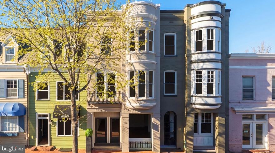 A rare mixed-use four level offering in the heart of Georgetown’s coveted East Village, 2611 P Street NW presents a distinctive opportunity as a discreetly separated Georgetown Live/Work luxury property, with future flexibility to convert into a 4-level residence. The property is configured as a 1,220 SQFT (second and third floor) contemporary style residence plus a 2-level (main and lower) 1,013 SQFT studio, with interiors defined by natural light, clean architectural lines, and a cohesive contemporary European design approach.
 
Prominently positioned along a vibrant stretch of P Street, directly across from Rose Park and within close proximity to Georgetown’s most established dining and retail destinations, this four-level Victorian townhome dates to 1892 and is attributed to noted British architect Frederick G. Atkinson. The façade reflects Georgetown’s classic architectural language, with painted brick and curved bay windows on the upper levels. Inside, the home is configured as a contemporary style residence, with interiors defined by natural light, clean architectural lines, and a cohesive contemporary European design approach.
  
Rebuilt down to the studs in 2017, the property incorporates all new mechanical, electrical, and plumbing systems, along with Deltalight architectural lighting throughout, complete with fully integrated home automation and in-wall touchscreen controls. Refined interior finishes with exceptional attention to detail include custom Poliform-built feature walls and cabinetry throughout the main living spaces. The modern, professionally equipped kitchen pairs chef’s functionality with a Miele appliance suite that can be fully concealed when not in use. Innovative storage solutions are found throughout, complemented by intricate backlit Poliform library and closets.
 
The upper residence includes two private balconies, along with custom interiors featuring Poliform cabinetry, Rimadesio doors, Agape bathrooms, Poliform kitchen, expansive island with breakfast bar seating, ideal for casual dining and entertaining, Miele appliances, and Deltalight architectural lighting. A Crestron smart home system with integrated automation and security provides seamless control throughout. Immaculate, never-occupied residence conveys fully furnished, including custom furniture and Donghia window treatments, allowing for immediate occupancy.
 
The upper-level primary suite offers generous proportions and a calm, architectural aesthetic, with custom illuminated built-ins and a linear fireplace framed in Carrara marble. The adjoining Agape bathroom is designed with a restrained, monolithic approach, featuring a floating double vanity and a single pane of glass enclosing the water closet and walk-in shower, both finished in continuous marble slab.

This offering combines the scale and character of a historic Georgetown residence with inviting modern European-tailored interiors, all in one of Washington’s most established and sought-after neighborhoods.