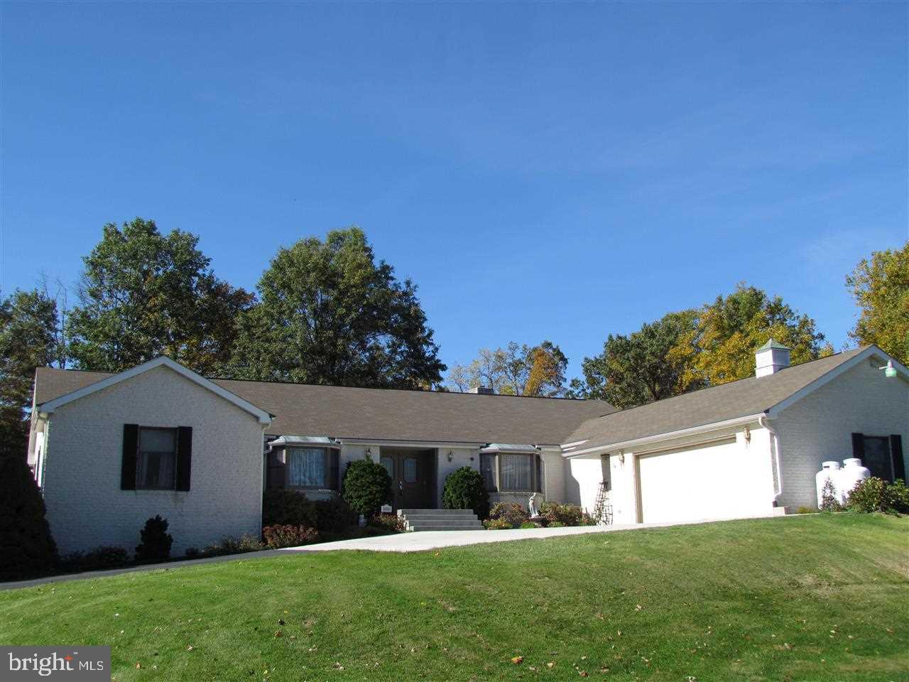 Large split rock rancher on over 8 acres of secluded park-like property; the deer, birds, & wildlife play in the yard as you enjoy your morning coffee on the huge patio!  One level living Master BR w/ walk-out to patio Master Bath w/ whirlpool tub & stand-up shower Bsmt FR w/ woodstove & built-in wet bar Potential in-law quarters & sep entrance Generator stays.