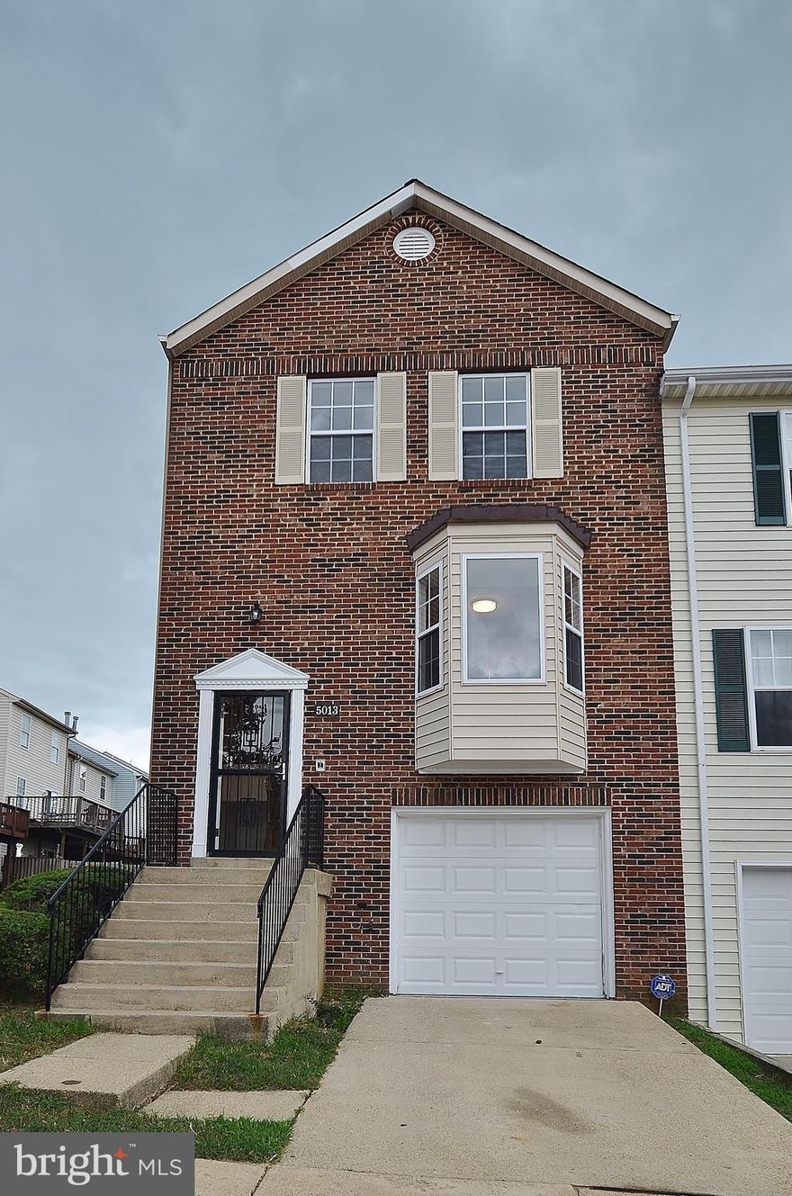 Beautiful 3 level, 3 bed, 2 full, 2 half baths, Brick front townhouse in excellent condition. This TH features, fresh paint, new carpet Brand  New Kitchen, 42" Cabinets, Granite top, SS Appliances, main level hardwood floor, New sliding door open to deck. Upgraded lights throughout, Remodel baths w/ Granite tops Lower level with family room w/ fire place  & half bath . Attached garage.