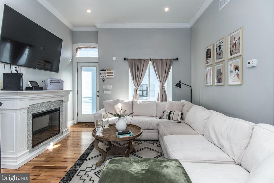 **PRICE REDUCED ON THIS STUNNING HOME! Welcome to your dream home in the heart of a vibrant neighborhood BOOMING with new construction.  Step into this stunningly renovated gem showcasing modern elegance and cozy charm.

On the first floor, you'll be greeted by an inviting open floor plan with gleaming hardwood floors. The  living room is perfect for gatherings, the dining area sets the stage for gathering around the table. Prepare to be wowed by the spectacular kitchen, featuring gorgeous 42”cabinets, decorative backsplash,  a stylish island, luxurious quartz counters, and top-of-the-line stainless steel appliances.

Head up to the second floor where two generously sized bedrooms and a den (which can be used as a bedroom or an office) await, complemented by an ultra-modern, super spacious ceramic hall bath.   But the show stopper awaits you on the third floor – a lavish primary suite boasting a huge closet, an awesome full bath, complete with a large ceramic shower and double vanity, providing a sanctuary of relaxation and indulgence.

Outside, a large fenced rear yard awaits, perfect for entertaining guests or accommodating furry friends. Plus, with the neighborhood experiencing a renaissance of new construction, there's no better time to invest in this vibrant community.

But wait, there's more! Bonus features include:fabulous crown molding t/o,  recently recoated roof with warranty, newer HVAC, updated electrical and plumbing systems.  This fabulous property isn't just beautiful – it's also super affordable! Enjoy the convenience of an interest rate 1% below market rate, along with a plethora of grants and closing cost assistance programs to make your homeownership dreams a reality.*eligibility requirements.