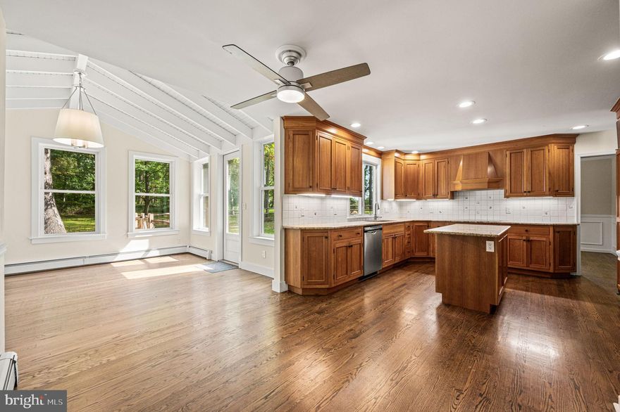 Rare opportunity for privacy, space, and style in Charlestown Township / Great Valley SD. Recently renovated 4BR/2.5BA home on 2+ private wooded acres with approx 3,040 SF and a 2-CAR garage. Interior updates include refinished HARDWOODS on both levels, designer-neutral paint, updated lighting, and newly insulated windows/doors/siding for energy efficiency. Smart-home dual-zone thermostats enhance comfort. A custom mahogany entry door with BALDWIN hardware opens to a slate-floor foyer, a 21-ft living room with abundant natural light, and a welcoming family room with exposed beams, built-ins, and a whitewashed WOOD-BURNING FIREPLACE, a standout for chilly nights. The renovated kitchen offers custom solid CHERRY cabinetry, GRANITE countertops, a center island, and new STAINLESS appliances including SUB-ZERO refrigerator and BOSCH cooktop/dishwasher. Adjacent four-season sunroom (14’ x 13.5’) with vaulted ceiling, full HVAC, and three walls of windows overlooks the serene backyard. Formal dining with wainscoting. Main level laundry, powder room, MUDROOM, and interior access to garage. Generator-ready: dedicated inlet in the garage. Upstairs features 4 large, generous sized  bedrooms, including a primary with walk-in closet and elegant updated MARBLE ensuite.  Unfinished basement provides excellent storage/workout/workshop options. Quick commute to Vanguard, Saint-Gobain, Vishay and other corporate centers. Convenient access to PA Turnpike (I-76), Route 202, Route 30, and SEPTA Malvern Regional Rail.  Outdoor living features two brick patios and a split-rail fenced area. Lease this Luxury Malvern Rental—a polished retreat with modern systems.