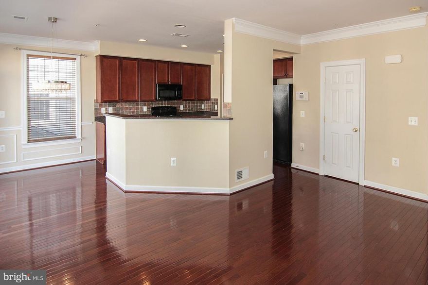 Beautiful light filled "townhome" style condo 3 bed/2.5 bath/1 car garage located within minutes to Reston Metro, future Innovation Ctr.Metro and Herndon Metro* Close to DIA* 9 in. ceilings, Cherry HW floors, and Crown Molding on the main level* Gourmet Kitchen w.42 inch maple cab., Granite CT.*Master BR on it's own level with Tray Ceiling,Walk in Closet,W/D and beautifully updated MB. LOCATION!!!