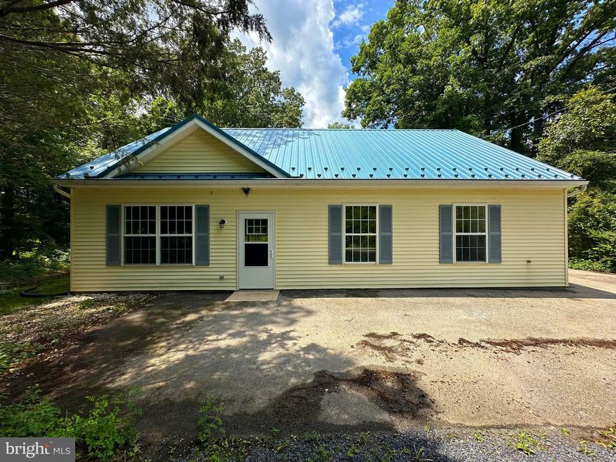 RARE OPPORTUNITY TO TAKE ADVANTAGE OF 100% USDA FINANCING IN PRINCE GEORGE'S COUNTY, MD!!! This beautifully renovated 4 bedroom, 3 full bath home is just about ready to hit the market!  Over 2,400 square feet of living space, 2 primary bedrooms & bathrooms (one on each level), 2 additional main level bedrooms, 1 more full bath, spacious kitchen, formal dining room, large living room and a wood burning fireplace!  The entire house has been remodeled and now contains luxury vinyl tile flooring in the living room, dining room, kitchen, main level master bedroom and hallways, new carpeting in the other bedrooms and ceramic tile flooring in all of the bathrooms!  The kitchen contains brand new stainless steel appliances and quartz countertops. There is an additional loft located on the upper level which overlooks the main level living room.  This property will not last long on the market!  The metal roof requires minimal maintenance and the lifespan is much better than that of a roof with architectural shingles. House includes the two adjacent parcels which makes the property have a total of 4.87 acres!