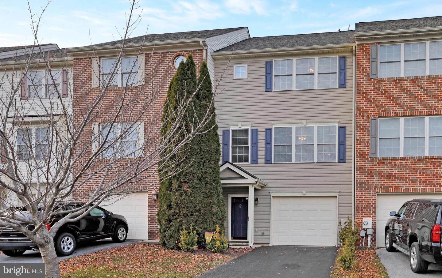 This beautifully maintained townhome, located in the desirable Hammonds Mill subdivision, offers convenience, comfort, and charm. Ideally situated near I-81, I-70, shopping centers, medical facilities, and within walking distance of the highly sought-after Spring Mills school district. With 1,710 square feet of finished living space, this home boasts upgraded hardwood flooring throughout—including the laminate-finished basement—and fresh paint that enhances its inviting atmosphere. The lower level features a welcoming foyer, spacious recreation room, laundry area, one-car garage, and a paver patio perfect for relaxing or entertaining. On the main level, enjoy an open-concept layout with a bright family room, dining area, kitchen with island, breakfast nook, and a convenient half bath. The kitchen appliances are just five years old and in excellent condition. Step out onto the 10x16 composite deck with low-maintenance railing—perfect for morning coffee or evening gatherings. Upstairs, you’ll find three bedrooms, including a spacious primary suite with a tray ceiling and ensuite bath. As-Is Condition