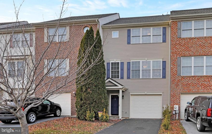 This beautifully maintained townhome, located in the desirable Hammonds Mill subdivision, offers convenience, comfort, and charm. Ideally situated near I-81, I-70, shopping centers, medical facilities, and within walking distance of the highly sought-after Spring Mills school district. With 1,710 square feet of finished living space, this home boasts upgraded hardwood flooring throughout—including the laminate-finished basement—and fresh paint that enhances its inviting atmosphere. The lower level features a welcoming foyer, spacious recreation room, laundry area, one-car garage, and a paver patio perfect for relaxing or entertaining. On the main level, enjoy an open-concept layout with a bright family room, dining area, kitchen with island, breakfast nook, and a convenient half bath. The kitchen appliances are just five years old and in excellent condition. Step out onto the 10x16 composite deck with low-maintenance railing—perfect for morning coffee or evening gatherings.  Upstairs, you’ll find three bedrooms, including a spacious primary suite with a tray ceiling and ensuite bath.  As-Is Condition