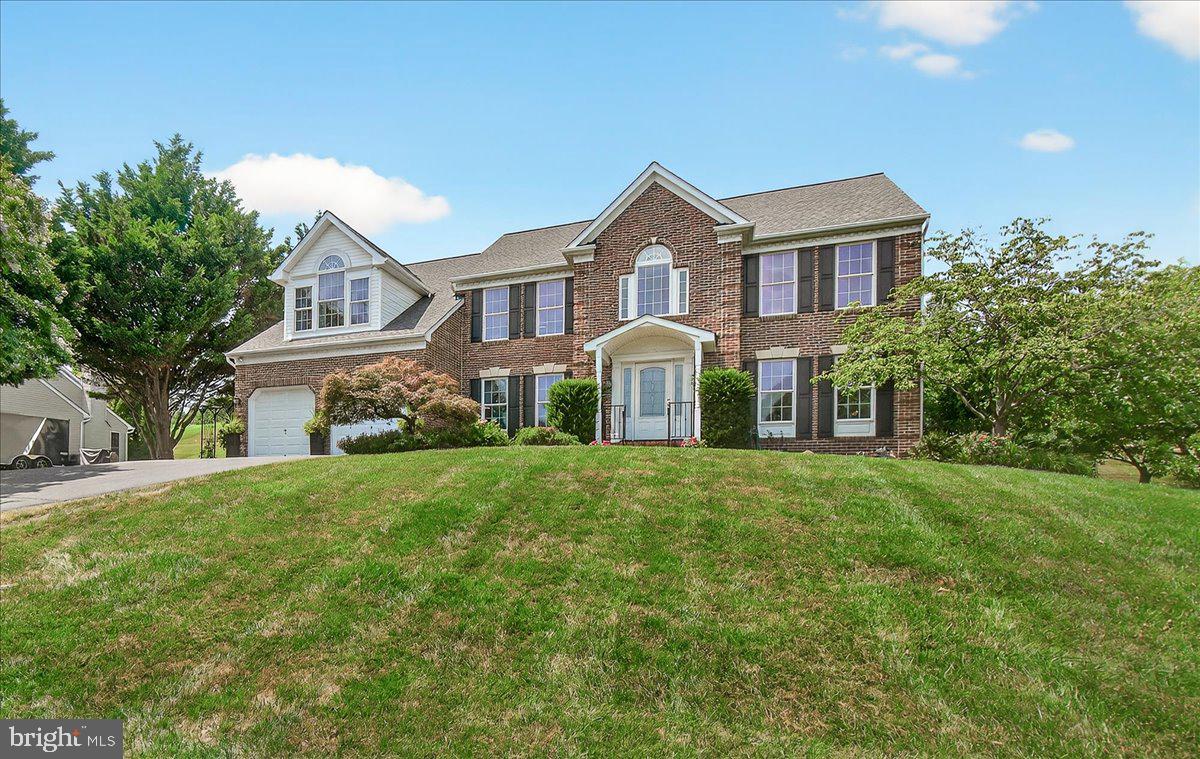 Welcome to the Highly Sought-After Community of Samhill Estates! This stunning and immaculate Colonial offers the perfect blend of Southern charm, luxury, and spacious living—boasting over 5,200 square feet of beautifully designed living space. One of the largest homes in the neighborhood, this property is an entertainer’s dream with a sun-filled sunroom, screened-in porch with vaulted wood ceiling, a generous Trex deck, and a patio ideal for gatherings and outdoor living. As you step through the front door, you're greeted by a grand two-story foyer featuring a curved staircase and gleaming hardwood floors. To the right, you'll find a large living room, and to the left, a formal dining room with crown molding—perfect for elegant dinners and entertaining. At the heart of the home is the newly custom eat-in kitchen, complete with stainless steel appliances, leathered granite countertops, subway tile backsplash, center island, pendant and recessed lighting, oversized coffee/wine bar with exposed brick, wine refrigerator and large pantry. The kitchen opens into a two-story family room with a gas fireplace and abundant natural light. A spacious office/library with built-in shelving offers the perfect work-from-home space or can serve as a 5th bedroom. Also on the main level powder room, two-car garage with interior access, laundry room with washer/dryer, utility sink, and ample cabinetry. Upstairs, retreat to the luxury primary suite, featuring a private sitting area, his/her walk-in dressing room like closet with built in dressers, and a spa-like en-suite with soaking tub and stand-up shower, three additional bedrooms—each generously sized and tastefully appointed—share a large updated full bath with double vanity, fully finished walk-up basement offers incredible bonus space, including a second family/recreation room; wet bar, hobby/flex area, full bath, access to the backyard. A wonderfully unique functional observation deck with ethernet and electric at the top of the hill behind the house for the star gazers. Samhill Estates is nestled in the vibrant Mount Airy area, home to local wineries, distilleries, community parks, and fine dining. The neighborhood offers easy access to major commuter routes (I-70, I-270, and Route 15), making travel to Washington D.C., Baltimore, Northern Virginia, BWI, and Dulles International Airport simple and convenient. Don't miss this exceptional opportunity to own a home that truly has its all-space, style, and location!