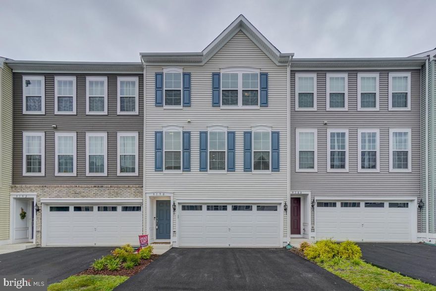 WOW! This townhouse is less than 2 years old and absolutely stunning. Three level, two car garage townhome built by Miller and Smith. Open concept main level has beautiful LVP flooring, updated light fixtures, quartz countertops. Expansive kitchen island and stainless steel appliances. Huge composite deck off of the living room. Large primary bedroom with walk in closet. Primary bathroom has huge shower and dual vanity. Laundry is on the upper level. Basement level has generous recreation room and half bath. Sliding glass door to outside patio and fenced in rear yard.  Come view this property today!