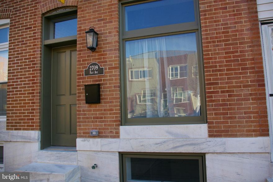 Stunning renovation with parking pad, roof deck,   dark wood floors, contemporary kitchen with cooktop, wall oven, and kitchen island.  The basement has great ceiling height, a bedroom, family room/den full bath, laundry with farm style door.  The top floor has a central skylight that cascades light through transoms into the bedrooms.  10 Year Chap Credit Application in process.