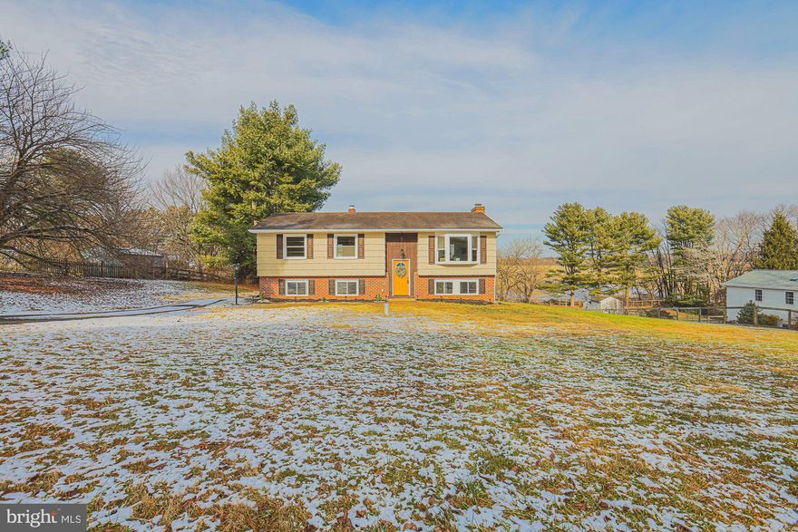 This well maintained split foyer home has been tastefully updated and checks all the boxes! Kitchen has been elegantly updated with new cabinets, Granite counters, and SS appliances. Bathrooms boast custom tile and quality finishes. 3 bedrooms, 2 full baths on the main level. The primary bedroom has it's own en-suite bathroom! Fully finished lower level is great for entertaining and has a mini bar with wine fridge. Huge bonus bedroom in lower level with fireplace and walk in closet and another full bath. Waterproof luxury vinyl planked floors in lower level. Original wood floors upstairs and under carpet in the bedrooms. Rear deck has stunning views from spacious back yard. New roof (2025), central air (2024) and all new well equipment (December 2024). One year home warranty included which covers all systems of the home. Enjoy quiet rural living yet still reasonably close to Jarrettsville, Hunt Valley and even York, PA. SEE IT TODAY!!!