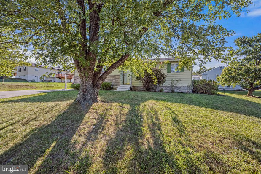 Please submit offers by 4 pm tomorrow 9/7 for seller review at 6pm, thank you. Conveniently located just off the Baltimore Washington Parkway and Route 198 in the East Laurel Russet area, this Maryland City rancher has a brand-new roof and gutters and a 2KW fully owned net metered solar panel system. The seller has added a double wide, six-inch-thick reinforced concrete driveway with carport for parking recreational vehicles, boats, work vehicles or up to 6 cars. The elementary school and swim club are centrally located in the neighborhood. There is no homeowner's association. Natural finished hardwood floors enhance the living room, dining area and all three bedrooms. Enjoy your private shower stall ensuite full bath or relax in the tub in the second full bath in the hallway. Set up your home office or gym in the private room downstairs and enjoy the spacious family room in your downtime. Both of these rooms have new carpeting. Warm up the living room with the wood burning fireplace or step out into the sun in the enclosed Florida room leading to the rear deck. The kitchen boasts a brand-new dishwasher and deep sink under a window which overlooks the back yard. There is plenty of storage in the lower-level unfinished area and two sheds. Other notable features include some replacement windows and Anderson storm glass or screen doors, an intercom system with bedside adaptability, replacement steel front door, insulated steel siding, two recently replaced sump pumps, and French drains. The electric panel was upgraded to 150 AMPS and the sewer line to the house from the street was replaced in 2005. Enjoyable gas heat and hot water. Home warranty in place and included with purchase covering buyer for a full year from close date. With groceries, shops and multiple restaurants right around the corner you won't need to go far but if you do BWI airport is only 12 miles away. The MARC Dorsey train station is only 10 miles away and there is a bus stop just 3/10ths of a mile from the house. This home is ready to move in  and waiting for your finishing touches!