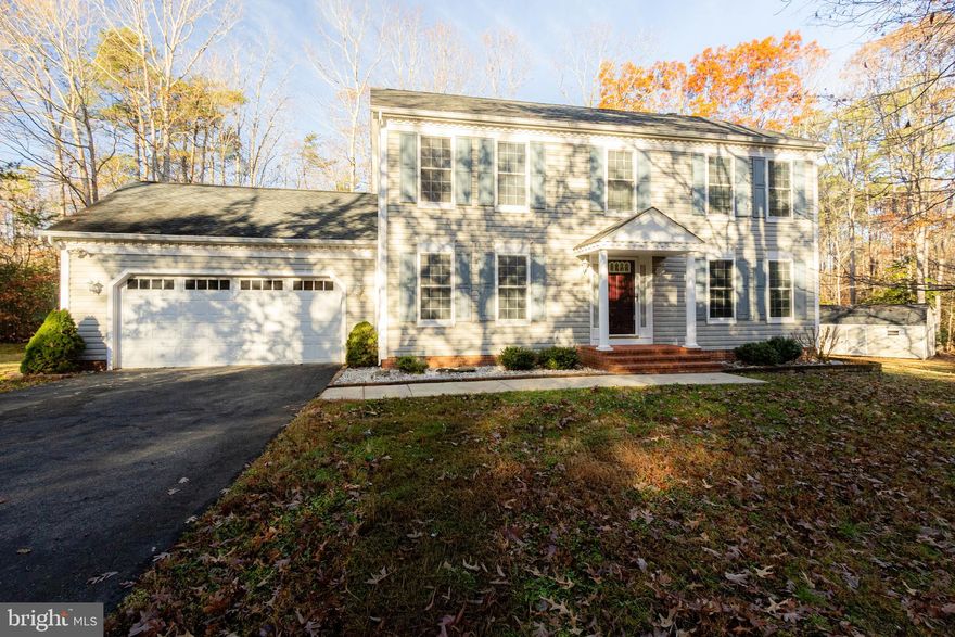 Nestled within one of the most desirable subdivisions, this classic two-story Colonial welcomes you home with charm and a sense of privacy on two  wooded acres
Step inside and feel the warmth of meticulously cared-for details : gleaming hardwood floors  through the main level,  a spacious separate dining room into a beautifully updated kitchen. Corian countertops, stainless steel appliances, and center island make it a joy to cook and gather  Kitchen opens into a cozy family room anchored by a wood-burning fireplace and  a light-filled sunroom with lots of  windows inviting the outside in.  Connecting deck overlooking your own peaceful woods

Upstairs, four generous bedrooms offer restful retreats, including a  primary suite with an  en-suite bath featuring dual vanities, a soothing soaking tub, a separate shower, and a spacious walk-in closet.

Practical touches complete the picture: an oversized two-car garage for all your toys and storage, plus a charming large Amish-built shed

Bonus! Encapsulated crawlspace w/ commercial grade dehumidifier, sprinkler system,  heat pump 2024, new roof 2016