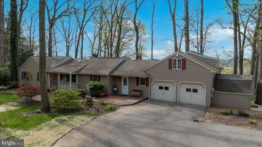 3000 sqft Rancher in Dallastown School District, situated on a private street and offers amazing countryside views for miles! This meticulously cared for home backs up to beautiful farmland. Just in time for summer, the outdoor area offers a deck and patio with private access to the master bedroom. The interior offers a bright and open layout. The chef in the family will love the gourmet kitchen with stainless steel appliances, marble counters, white cabinetry, and a center island with seating. Open to the kitchen is the dining room and a great room is adjacent to the kitchen and dining area. The great room is highlighted by a vaulted ceiling, countryside views, and access to the rear deck. Three nice sized bedrooms, 3 full baths, a laundry room, and a sitting room with a cozy fireplace completes the main level. The lower level is ideally laid out for entertaining and relaxing! The lower level rec room offers a wet bar and built-in entertainment center. This home offers a unique and functional layout with plenty of room for the family. The upper level includes a spacious bedroom tucked away from the main living area. This could be perfect for guests or a teenager’s bedroom. Great location - just minutes to I83 and easy commute to Maryland.