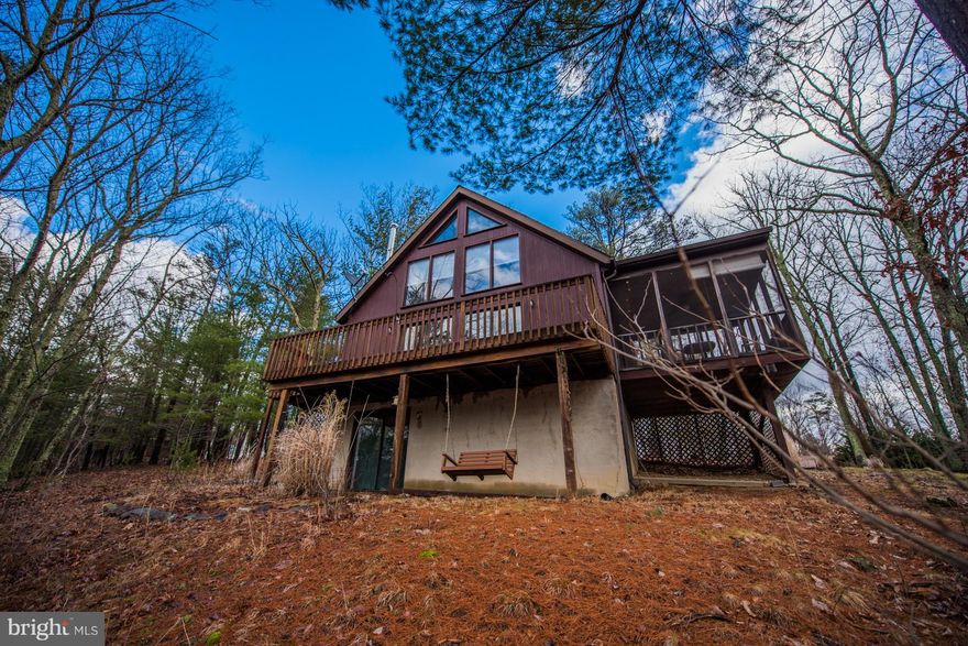 Spend winter months snuggled next to the wood stove while viewing mountain views. Enjoy warmer months from the deck, screened deck, or take a short ride to State Park for swimming, fishing, hiking, golf, & much more. Inviting Great Room w/ wood floors & granite counter tops, new carpet, partially finished walk out bsmt with private patio. Recently upgraded w/ roof & heat pump + Sleepy Creek access