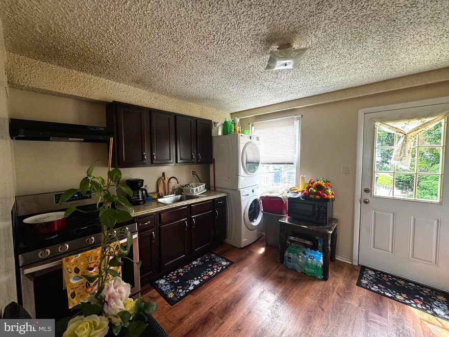 This corner row home in Armistead Gardens is move-in ready and full of charm. It has 2 bedrooms and 1 bathroom, designed for easy everyday living. On the main level, you’ll find brand-new flooring that’s strong and easy to maintain, along with a washer and dryer conveniently located in the kitchen. Upstairs, the bedrooms feature beautiful hardwood floors that bring warmth and character. The home has been freshly painted throughout, with updated light fixtures and a remodeled bathroom for a bright, modern look. Outside, enjoy your own off street parking and a large yard perfect for relaxing, entertaining, or gardening. Schedule your tour today and make it yours!