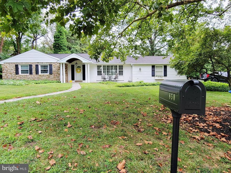 Price Reduced! Stunning Expanded Ranch with Golf Course Views, Located Directly across from the prestigious Whitemarsh Country Club Golf Course and you will find this exquisite ranch-style residence offers a harmonious blend of comfort and luxury. Spanning an impressive 0.65 acres, the corner lot provides ample space for outdoor enjoyment while ensuring privacy and tranquility. As you approach this charming Stone and Siding Ranch Style Home, the winding brick pavers and mature landscaping invites you in, hinting at the warmth and elegance that awaits inside. The spacious interior and  thoughtfully designed living space, featuring three generously sized bedrooms and two and a half bathrooms. The layout is perfect for both entertaining and everyday living, with an inviting flow that enhances the sense of home. Step into the heart of the home, The expansive Family Room Addition with Vaulted Ceilings, Built-in Shelving and a cozy gas fireplace create a welcoming ambiance, perfect for gathering with loved ones on chilly evenings and French Doors opening to the expansive upgraded Deck. A full sized Formal Living Room and Dining Room Open into the Bright and Upgraded Kitchen with Beautiful Cabinets, Stainless Steel Appliances and Quartz Countertops. The combination of hardwood, carpet, and ceramic tile flooring adds a touch of sophistication while ensuring comfort throughout. Upgrades include new composite deck, all new hardwood flooring in the foyer, dining room, and kitchen, all new kitchen cabinets, countertops, appliances, and opened up the wall between the dining room and kitchen, new lighting throughout the whole house, new rugs in the hallway and 2 of the 3 bedrooms, converted the house from a 2 bedroom back to the original 3 bedrooms, every room in the house has been painted, new vanities in all the bathrooms. The unfinished basement offers endless possibilities for customization, whether you envision a personal gym, a home theater, or additional storage. The attached oversized garage, complete with built-in storage and inside access, provides convenience and functionality, making it easy to transition from outdoor activities to the comfort of home which also has an automatic natural gas generator. The driveway offers additional parking, accommodating guests with ease. One of the standout features of this property is its prime location, adjoined to a picturesque golf course. Imagine sipping your morning coffee on the front patio while soaking in the serene views, or enjoying leisurely afternoons on the lush greens just steps from your door. Experience the perfect blend of elegance, comfort, and convenience in this remarkable property, where your dream of upscale living can become a reality.