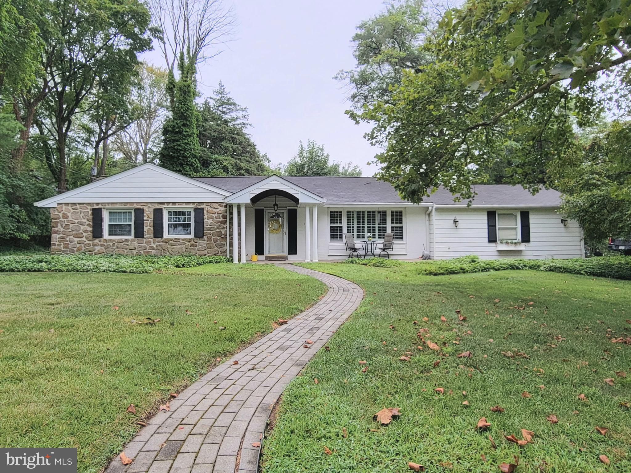 Price Reduced! Stunning Expanded Ranch with Golf Course Views, Located Directly across from the prestigious Whitemarsh Country Club Golf Course and you will find this exquisite ranch-style residence offers a harmonious blend of comfort and luxury. Spanning an impressive 0.65 acres, the corner lot provides ample space for outdoor enjoyment while ensuring privacy and tranquility. As you approach this charming Stone and Siding Ranch Style Home, the winding brick pavers and mature landscaping invites you in, hinting at the warmth and elegance that awaits inside. The spacious interior and thoughtfully designed living space, featuring three generously sized bedrooms and two and a half bathrooms. The layout is perfect for both entertaining and everyday living, with an inviting flow that enhances the sense of home. Step into the heart of the home, The expansive Family Room Addition with Vaulted Ceilings, Built-in Shelving and a cozy gas fireplace create a welcoming ambiance, perfect for gathering with loved ones on chilly evenings and French Doors opening to the expansive upgraded Deck. A full sized Formal Living Room and Dining Room Open into the Bright and Upgraded Kitchen with Beautiful Cabinets, Stainless Steel Appliances and Quartz Countertops. The combination of hardwood, carpet, and ceramic tile flooring adds a touch of sophistication while ensuring comfort throughout. Upgrades include new composite deck, all new hardwood flooring in the foyer, dining room, and kitchen, all new kitchen cabinets, countertops, appliances, and opened up the wall between the dining room and kitchen, new lighting throughout the whole house, new rugs in the hallway and 2 of the 3 bedrooms, converted the house from a 2 bedroom back to the original 3 bedrooms, every room in the house has been painted, new vanities in all the bathrooms. The unfinished basement offers endless possibilities for customization, whether you envision a personal gym, a home theater, or additional storage. The attached oversized garage, complete with built-in storage and inside access, provides convenience and functionality, making it easy to transition from outdoor activities to the comfort of home which also has an automatic natural gas generator. The driveway offers additional parking, accommodating guests with ease. One of the standout features of this property is its prime location, adjoined to a picturesque golf course. Imagine sipping your morning coffee on the front patio while soaking in the serene views, or enjoying leisurely afternoons on the lush greens just steps from your door. Experience the perfect blend of elegance, comfort, and convenience in this remarkable property, where your dream of upscale living can become a reality.