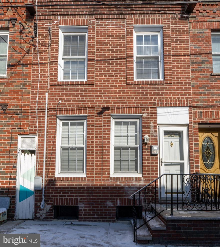 Cozy home in the well sought Pennsport area. This home has been updated recently. It has a newer heater and hot water tank, 100 AMP electric and hard wired smoke detectors. New windows throughout this well maintained home. The kitchen features granite tops, refrigerator, microwave, dishwasher and garbage disposal. Plenty of cabinet space in this kitchen. The yard has a newly poured concrete an is a nice size. There are laminate floors and a washer dryer in the unit too. Easy access to highways and transit oriented. Close proximity to eateries and shopping. This one won't last so make your appointment today.