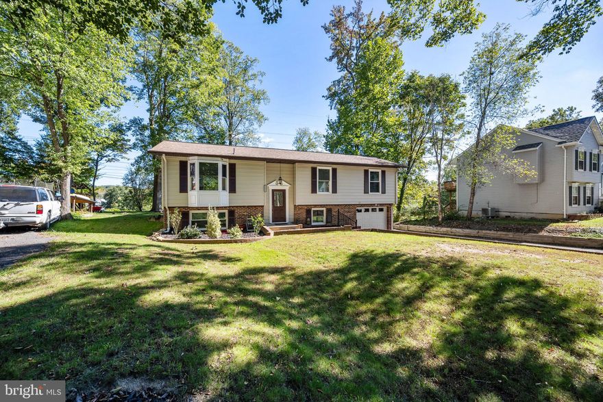 ***Offer Deadline 01/26/2025 @ 7pm*** Discover Peace and Modern Comfort in Aquia Harbor
Step into your dream lifestyle with this stunning 4-bedroom, 3-bath home nestled on a spacious half-acre in the amenity-rich Aquia Harbor community. From the sun-soaked sunroom, perfect for peaceful mornings, to the chef’s kitchen with stainless steel appliances, pearl-white soft-close cabinets, and granite countertops, every detail is designed for elegance and functionality. The upper level features gleaming hardwood floors, while the finished lower level boasts ceramic tile and a cozy wood-burning fireplace. A versatile den adds flexibility for a home office or reading nook, and an attached one-car garage provides convenience.

Ideally located just 2 miles from Stafford Marketplace and Walmart Supercenter and only 1 mile from I-95, this home offers the perfect blend of seclusion and accessibility. Enjoy the vibrant amenities of Aquia Harbor while living moments from shopping, dining, and commuter routes. Don’t miss your chance to own this gem where comfort, luxury, and nature come together seamlessly. Your dream home awaits!