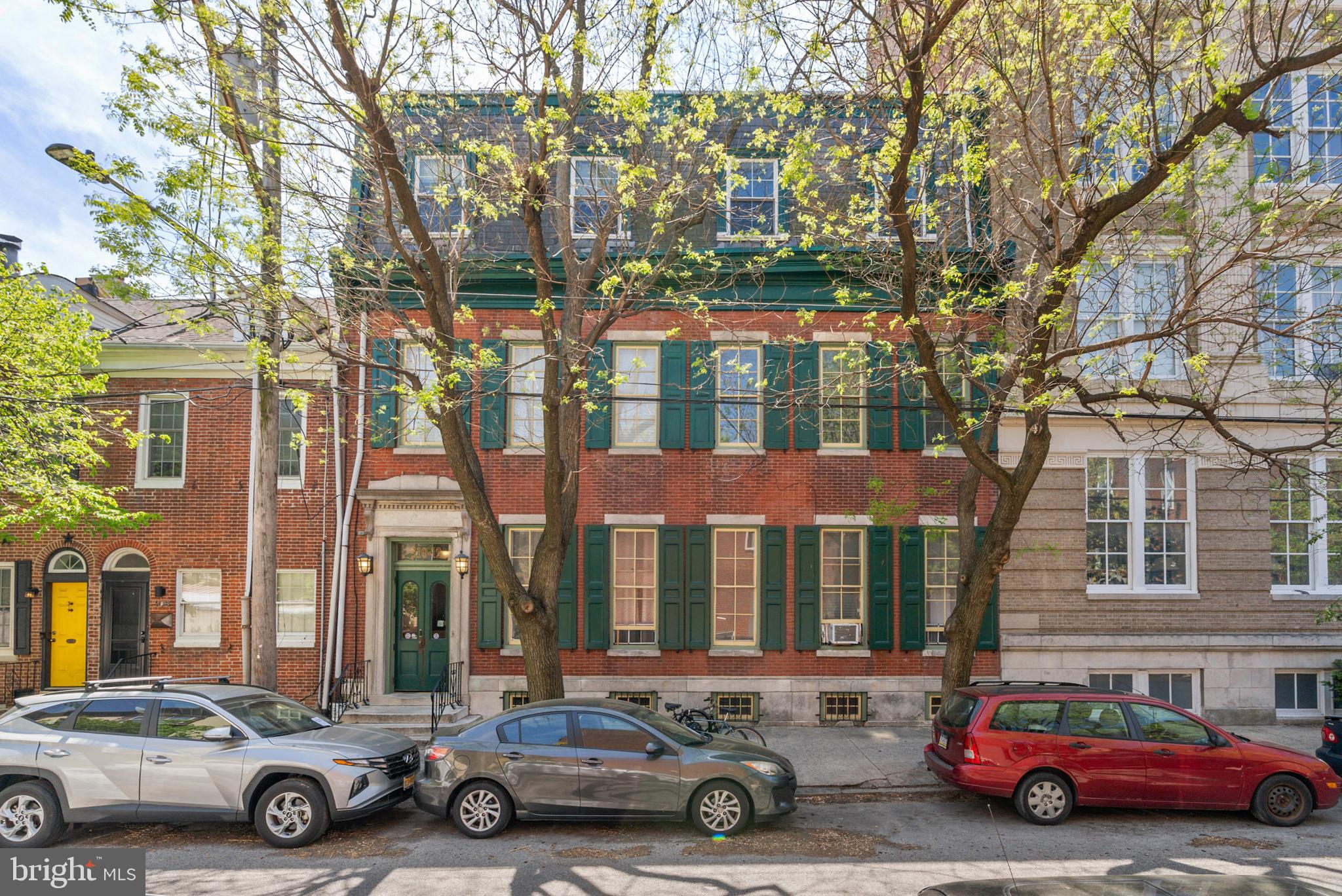 Welcome to 310-312 Catharine St #C—a newly renovated 2-bedroom, 2-bath flat with available parking, nestled in the heart of historic Queen Village. This rare offering features modern upgrades blended seamlessly with timeless architectural charm. Set within a stunning historic building, this home boasts soaring 11-foot ceilings, exposed brick walls, and hardwood flooring throughout. The open-concept layout connects the living, dining, and kitchen areas, creating a bright and inviting space ideal for both entertaining and everyday living. The kitchen is outfitted with quartz countertops, stainless steel appliances, and a peninsula with breakfast bar seating, while both bathrooms are finished with stylish, contemporary touches.
The spacious primary bedroom includes thoughtfully designed custom closet build-outs, maximizing storage.
Additionally, tucked just off one of the bedrooms, you'll find a charming sunroom extension—a bright and versatile bonus area that can flex effortlessly as a home office, reading nook, nursery, or personal retreat, tailored to your lifestyle. One of the standout features of this home is the available parking space—an incredible convenience in the city and a true rarity in this sought-after neighborhood. Located on a tree-lined street in the prestigious Meredith School Catchment, this home offers access to one of Philadelphia’s top-rated public schools. Queen Village itself is a vibrant, walkable neighborhood rich in history and local charm. Enjoy coffee at neighborhood favorites like Shot Tower Coffee or Red Hook Coffee and Tea, browse handmade goods at Moon & Arrow, or pick up a good book from Head House Books. Outdoor spaces like Mario Lanza Park and Weccacoe Playground offer green space for relaxation, pets, and play. You’re also just minutes from neighborhood gyms, locally owned boutiques, grocery stores, and an array of cafes and restaurants. Commuting is a breeze with convenient access to I-95 and I-676, while the peaceful, community-oriented atmosphere makes this neighborhood one of the most desirable in the city. This is a unique opportunity to own a piece of Queen Village’s historic charm with all the comforts of modern city living.