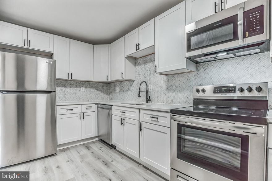 STUNNINGLY UPDATED END UNIT WITH AN ATTACHED GARAGE! Fully available and ready for immediate move in! This open concept home is finished to an HGTV standard and completely move-in ready! Enjoy NEW LVP flooring throughout, new windows, ample storage, new deck, and all new lighting! UPDATED kitchen with quartz counters, matte black finishes, custom backsplash, and all new stainless steel appliances. Two FULLY RENOVATED BATHROOMS, showcasing a beautiful custom shower in the primary en-suite. Primary bedroom is spacious enough for a kings size bed, and features a large walk-in closet opposite the attached bath. Tucked away in the heart of Waldorf with east access to shopping, dining, entertainment, parks and more! Don't forget to stop pay the numerous community amenities on your way out of the neighborhood (including pool and playground!) Convenient commute to Northern Virginia, AAFB, DC and National Harbor. * Seller Prefers using New World title for closing * VA financing or cash offers only