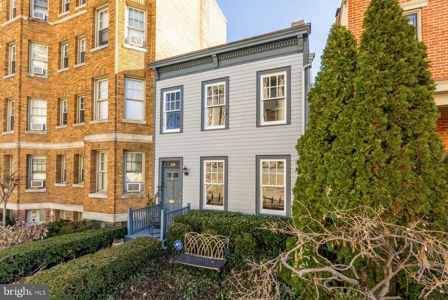 Ideally positioned in the heart of Capitol Hill, 19 2nd Street NE offers a rare opportunity to own a substantial and historically significant residence in one of Washington’s most iconic settings. Located just steps from the U.S. Capitol, House and Senate office buildings, the Library of Congress, the Folger Shakespeare Library, and directly across from the Supreme Court, this exceptional home places the very best of the nation’s capital just outside your door.

Originally built in 1852, the residence seamlessly blends its historic Italianate character with a thoughtfully designed 1976 architectural expansion that is virtually invisible from the street. Behind the classic 19th-century clapboard façade lies an unexpectedly expansive homeoffering remarkable scale, light, and versatility across multiple levels, including a full high-ceilinged cellar.

The interior is distinguished by gracious proportions, antique flooring, soaring ceilings, tall windows, refined architectural details, and exceptional storage throughout. Up to four bedrooms and two-and-a-half baths provide flexibility for modern living, while the dramatic top-level space with its striking 20-foot beamed ceiling adds a memorable architectural focal point. A generously sized kitchen and dining area open to an exquisitely landscaped, cloistered triple-size evergreen garden, creating a rare private outdoor retreat in the city. Private parking completes the offering, with ample guest parking available nearby on evenings and weekends.

This premier location also offers effortless access to Eastern Market, Pennsylvania and Massachusetts Avenue dining and shopping, Union Station, multiple Metro lines, Reagan National Airport, major commuter routes, parkland, the Potomac River, and extensive biking and recreational amenities.