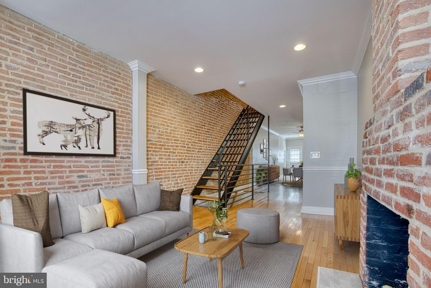 A gem in South Baltimore! This home has it all! 3 Bedrooms , 3 full baths & 1 half bath-**all above grade**, roof top deck, finished basement and a one car parking pad in the rear! The best of both worlds, renovated but with a nod to historic preservation. Amenities include exposed brick, hardwood floors throughout, modern open staircase , recessed lighting, ceiling fans, roof top deck, central AC /forced air, and high ceilings. The main level boasts an open floor plan with a living room with decorative fireplace, dining room, kitchen, large coat closet and half bath. Upper level 1 has a primary suite with an en suite bath, a hall bath and bedroom #2, on upper level two you will find bedroom #3 and full bath #3 as well as a flex space/ area with the door to the back deck.  The back deck has a spiral stair case to the roof top deck which has panoramic views of the Baltimore skyline.  You can see landmarks like Ravens Stadium, The Bromo Seltzer Tower, and The  World Trade Center. Recent updates include: 2022 New Carpet in Basement, Entire Interior painted, Floors refinished on 3rd floor. 2021 New Roof, 2New Decks. 2018 New Hardwoods in Second Floor bedrooms. 2014 New HVAC, New Poured Concrete Parking Pad. 2012 New Appliances-Washer/Dryer, Refrigerator, Microwave.   Located with easy access to I95 and short walk to historic Riverside Park where you can walk your dog , swim in the pool or enjoy the outdoor concert series. Easy to show.