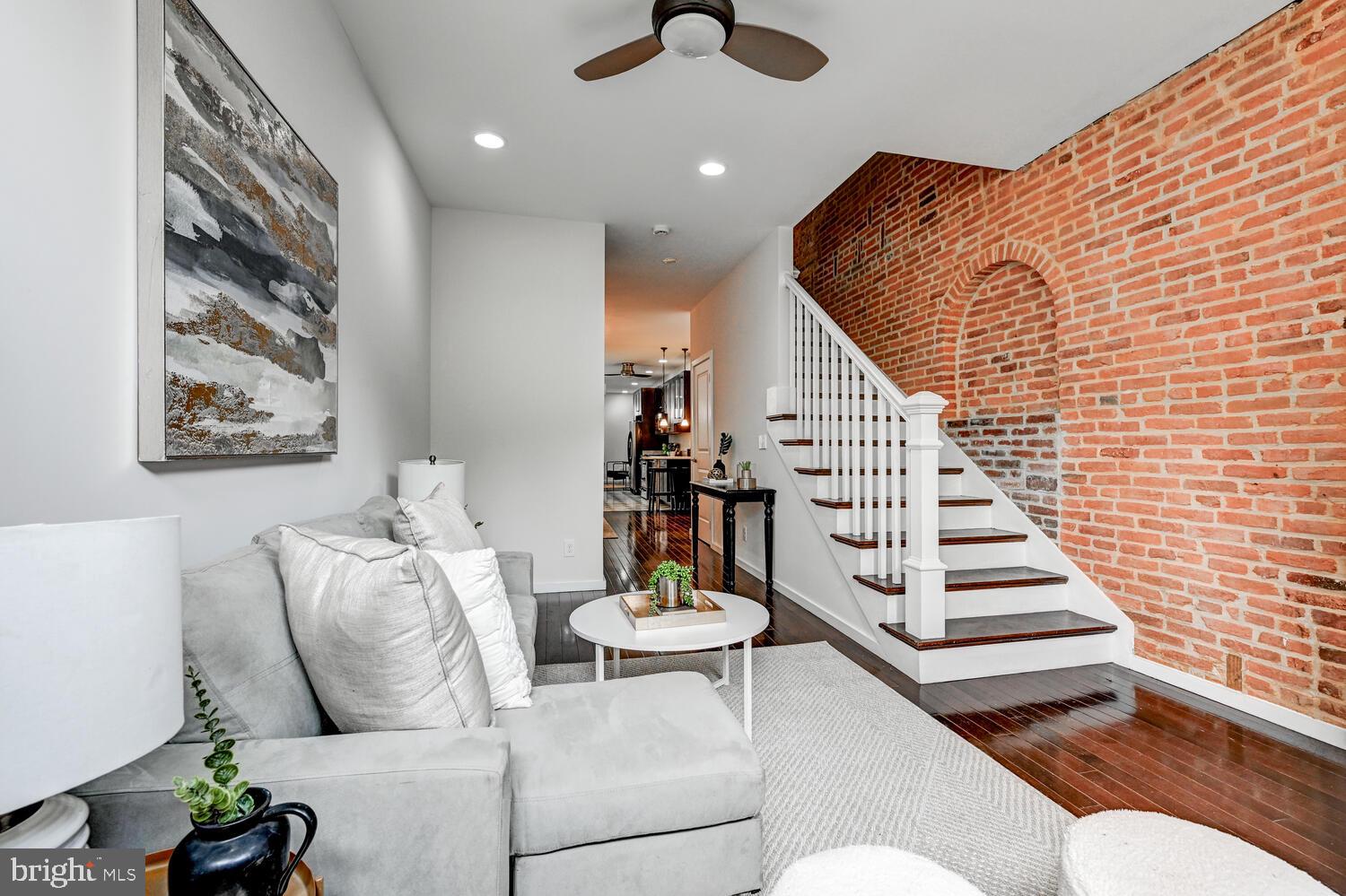 This is a really charming, renovated home in Federal Hill WITH PARKING for 2 CARS. These lots are super deep, so you have a nice sized deck, yard with pavers, plus 2 car parking out back! Hard to get at this price point. The brick accent walls with beautiful archway pattern add so much charm to this home. The main level has 2 living spaces, plus a dining area, updated kitchen and powder room. Upstairs are three bedrooms, two full baths (one en-suite) and a second deck off the back. The laundry room is located on the bedroom level for ease and convenience. There is a full unfinished basement with interior access that has good height. Stroll over to M&T Bank Stadium for game days. Top Golf and so many great amenities within blocks!