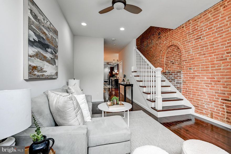 This is a really charming, renovated home in Federal Hill WITH PARKING for 2 CARS. These lots are super deep, so you have a nice sized deck, yard with pavers,  plus 2 car parking out back! Hard to get at this price point. The brick accent walls with beautiful archway pattern add so much charm to this home.  The main level has 2 living spaces, plus a dining area, updated kitchen and powder room. Upstairs are three bedrooms, two full baths (one en-suite) and a second deck off the back. The laundry room is located on the bedroom level for ease and convenience. There is a full unfinished basement with interior access that has good height.  Stroll over to M&T Bank Stadium for game days.  Top Golf and so many great amenities within blocks!
