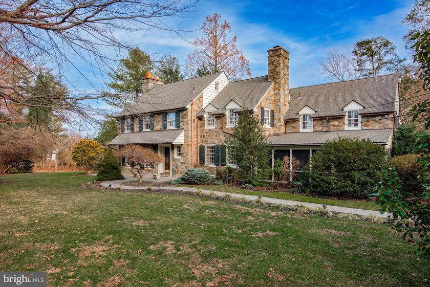 This stately, five bedroom, five full and one-half bathroom, McDevitt stone colonial has incredible architectural detail and curb appeal. The home sits on ¾ acre of beautiful level grounds. From the impressive entry foyer there is a full view of an exquisite architectural archway which opens to a grand, sunlit, and elegant dining room with a huge bay-window. The French door from the formal dining room opens to a secluded, walled patio, perfect for outdoor entertaining. The renovated and updated Chef’s kitchen has a dramatic Palladium window, a large island, 2 sinks, 2 dishwashers, granite countertops, double oven, and a 6-burner cooktop. The living room is elegant and spacious with a large fireplace and custom built-ins.
The den with carved wooden fireplace opens to a large flagstone screened-in porch. A first-floor powder room and hallway to attached garage complete the first floor.
A handsome staircase leads to a generous landing with access to an exceptional primary suite. This suite has a carved marble fireplace, enormous, custom, walk-in closet, and bathroom with laundry. There are four additional large bedrooms on this floor – two with ensuite bathrooms and two that share a hall bathroom. A staircase to a large, floored attic with a cedar closet is a perfect option for further expansion and/or storage. The Lower-level has a huge family/game room, a fireplace, a wet-bar, full bathroom, bonus room and storage area. A second washer and dryer in the basement provide extra convenience.

Other special features include attached garage wired for electric vehicle charging, gorgeous hardwood floors throughout, security system, 2-zoned air-conditioning, newer roof and gutters, as well as lower level and 2 nd floor laundry facilities.
This beautiful home is a perfect blend of old-world grace and charm with all the modern conveniences. Walkable to Narberth and Penn Valley commercial center, schools, and transportation.
Showings start at the open house Friday Feb 16, 1-4pm. Opens also scheduled for Saturday and Sunday 2-4pm