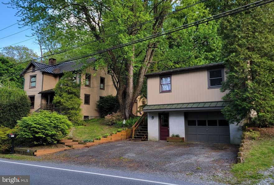 Set on 1.12 acres, surrounded by peaceful woods, this beautifully maintained Victorian home blends timeless character with thoughtful modern updates. Fully remodeled in 2011, the home features 3 bedrooms and 2 full baths with a warm and inviting layout throughout. The kitchen offers granite countertops, tile backsplash, and custom cabinetry, while the spacious great room showcases cathedral-style ceilings featuring two skylights, a Palladian window to view wildlife, and a bar area with a built-in kegerator and tap, all perfect for entertaining. Impress your guests with decorative details like French double pocket doors and window corner blocks, alongside modern comforts like the recently installed smart toilets, reverse osmosis drinking water system and heated flooring through most of the home.

Above the detached garage, you’ll find a 4-room finished living space complete with its own recently installed heat/ cool system and full bath. Make this an office, studio, or a more private and comfortable space for guests.