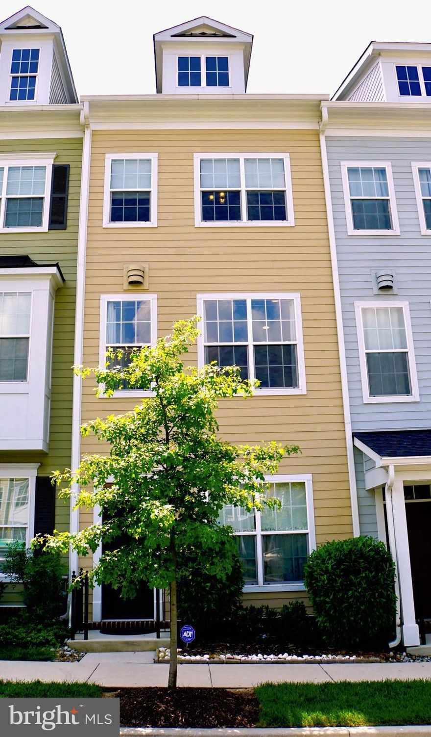 Lovely Towson Green townhome overlooking landscaped open space. Wood floors on the main level. 2/3 carpeted bedrooms, 2 Full & 2 Half baths. Lower level den. Large open living/dining area with FP. Private deck off kitchen &  large private balcony off optional third bedroom. Gourmet kitchen w/ granite countertops, stainless steel appliances.1 car garage. Urban style living/walk to everything Towson