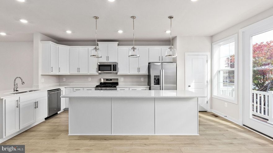 Discover Mary’s Landing, a new construction townhome community in the heart of Fredericksburg. These modern three-level homes with two-car garages combine style, space, and low-maintenance living just minutes from downtown shops, dining, and the Rappahannock River. Enjoy historic charm, outdoor recreation, and convenient access to I-95, Route 1, and the VRE—making commuting simple and weekends full of possibilities. Step inside the Upton on the lower level, where a welcoming recreation room greets you from either the front entry or the rear two-car garage. On the main level, the Upton shines with an open-concept design. The spacious family room provides plenty of room for relaxation and entertaining, with the option to add a cozy fireplace as a focal point. The adjacent kitchen is the true centerpiece, featuring a large island, ample counter space, and a dedicated dining space. Extend your living space outdoors with the optional sliding glass door and rear deck—perfect for morning coffee or evening gatherings. Upstairs, the Upton continues to impress with three bedrooms, two full bathrooms, and convenient bedroom-level laundry. Two secondary bedrooms share a hall bath, while the private primary suite offers a walk-in closet and a luxurious bathroom complete with dual sinks and a walk-in shower. The Upton is more than a townhome—it’s a home designed for modern living, offering the flexibility to adapt to your life style today and for years to come.