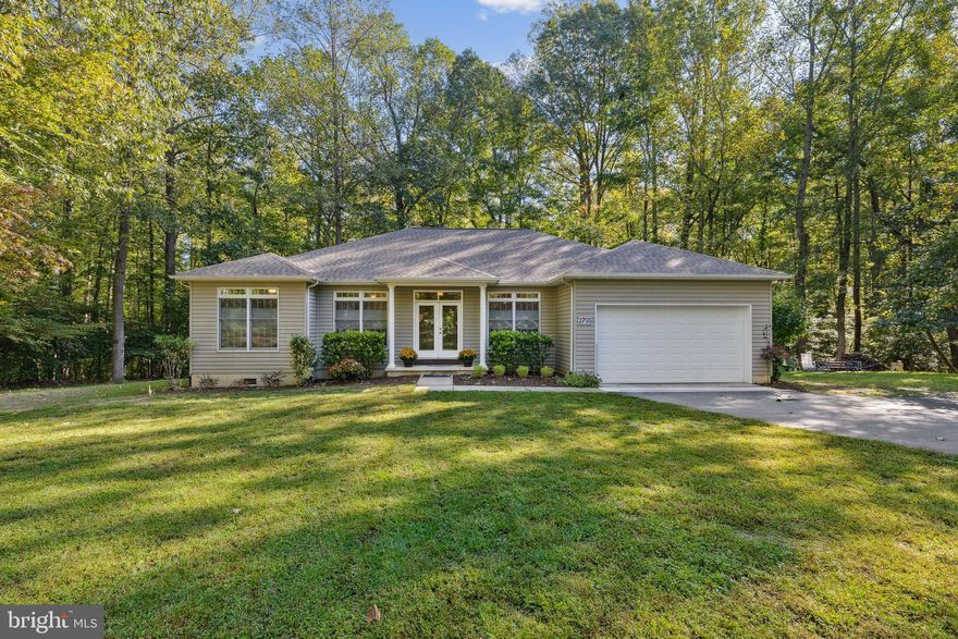 This home boasts a cozy and stylish atmosphere. Its sturdy construction and high ceilings create an open and inviting ambiance. The living room and family room, complete with a propane fireplace, offer plenty of space for both relaxation and entertainment. The three bedrooms and two full bathrooms provide ample accommodation for family and guests. The updated galley kitchen features stainless steel appliances, natural cherry wood cabinetry, and beautiful Corian countertops. The main living areas are adorned with stunning hardwood flooring, while the bedrooms are carpeted for added comfort. To keep you warm during the winter, the home is equipped with an energy-efficient heat pump with a propane gas backup system. The basement features a large storage/workshop area with double French doors for convenient access to outdoor toys and a plant stand with grow lights. The roof was recently replaced in 2021 with 30-year architectural shingles, ensuring durability and peace of mind.  Located in a peaceful and serene setting, you can enjoy your mornings on the covered porch surrounded by mature trees, soaking in the soothing sounds of birds chirping. It's the perfect spot for hosting summer barbecues and engaging in outdoor activities. Jefferson Patterson Park, less than 1/4 mile away, offers 560 scenic acres alongside the Patuxent River, perfect for hiking and kayaking. This home is truly a perfect place to call home.
Check out the drone footage and matterport tour