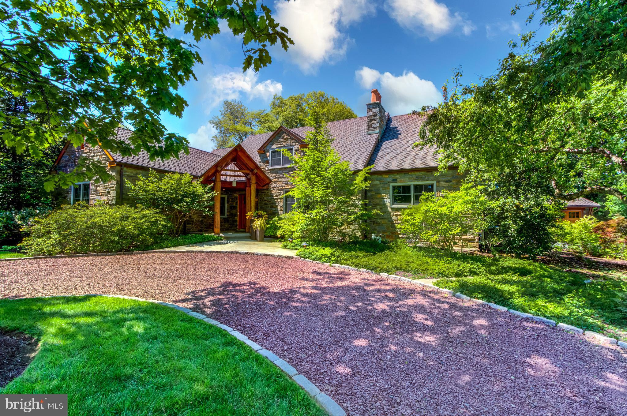Welcome to 344 Ardmore Ave, creatively designed to connect to the outdoors to indoor living. This home offers peaceful serenity for today's modern family every season of the year! Situated on more than an acre with mature landscape. The architect used a blend of traditional materials to create a refined contemporary architecture. Incorporating a variety of woods, stone & glass to embrace its surroundings, the home captures the natural beauty of all four seasons. High-end amenities, custom lighting and controls, plus an integrated home entertainment system- wired for today's information age and is complemented by the stylish interior design & elegant decor. As you approach this gorgeous home will appreciate the steeply pitched Portico and a 50-year life-cycle roof. The first floor offers two large bedrooms, one of which is a master suite with a sitting lounge and pocket doors opening to the great room. Perfect for accommodating out of town family or guests or used as an in-law suite. Upstairs you will find two in-home offices and a Grand master suite. This home offers the flexible space so many seek to work effectively from home. The large office includes blueprints for anyone interested in transforming this space into an additional en-suite. The smaller office can be utilized as an additional bedroom or nursery. The master is stunning and includes a large sitting room, elevated bathroom, dressing area, hand-crafted wood ceiling and headboard. The large windows and patio door open to a cozy balcony with commanding views of the backyard. The master bath includes a whirlpool tub, separate stall shower, and makeup vanity all detailed with beautifully travertine, ocean side glass, and hand-made mosaics. The upstairs is complete with a spacious balcony overlooking the great room, an ideal space for gathering your thoughts. Positioned across from the historical Merion Golf Club (ranked #6 in the country) the true beauty of this gorgeous home is THE BACK YARD! A private oasis unlike any other. The horseshoe terrace with gas Viking grill offers an instant escape and a spacious area for entertaining. Serenade your guests with music from the exterior, outdoor speakers, or slide open the piano room doors and relax to one of Beethoven's nine symphonies or chopsticks. The backyard is flat allowing an opportunity to add a swimming pool. Nestled in an exceptional location this home allows for convenient access to the Philadelphia Airport, Center City via multiple train lines, proximity for highway access, and is minutes from downtown Ardmore. This captivating contemporary layout and design offers opulent comfort for today’s modern family. The owner/architect has made this home a dream come true in every sense, a vacation home for day-to-day living.
